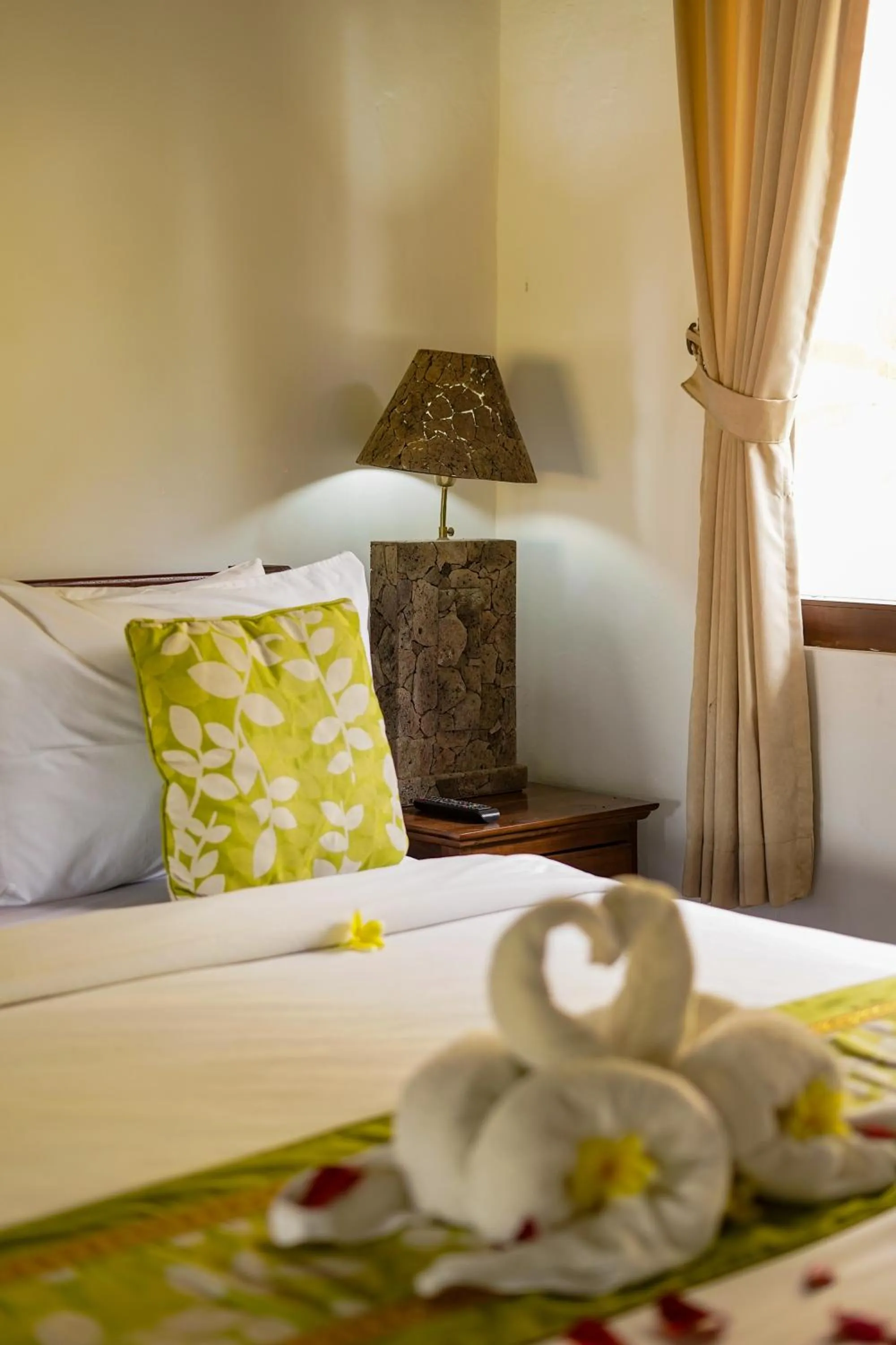 Bed in Three Brothers Bali Legian Bungalows & Villas