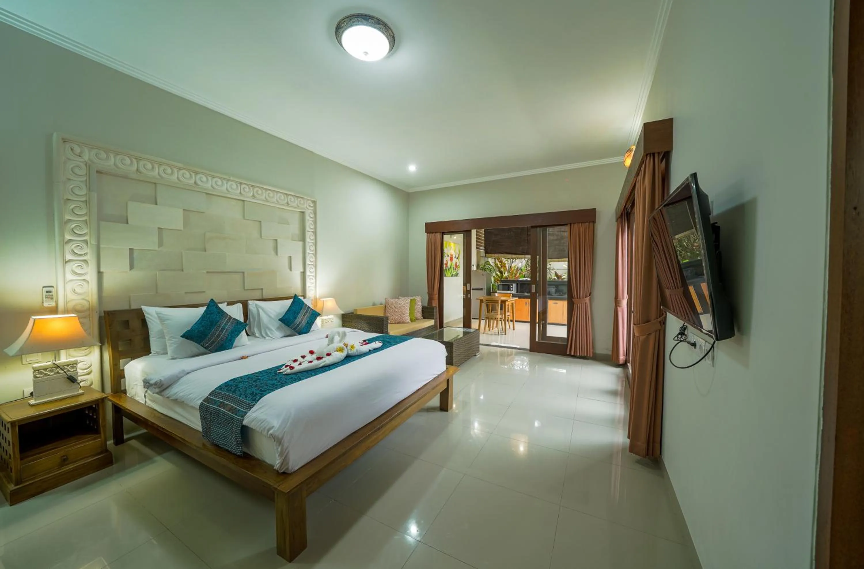 Bed in Three Brothers Bali Legian Bungalows & Villas