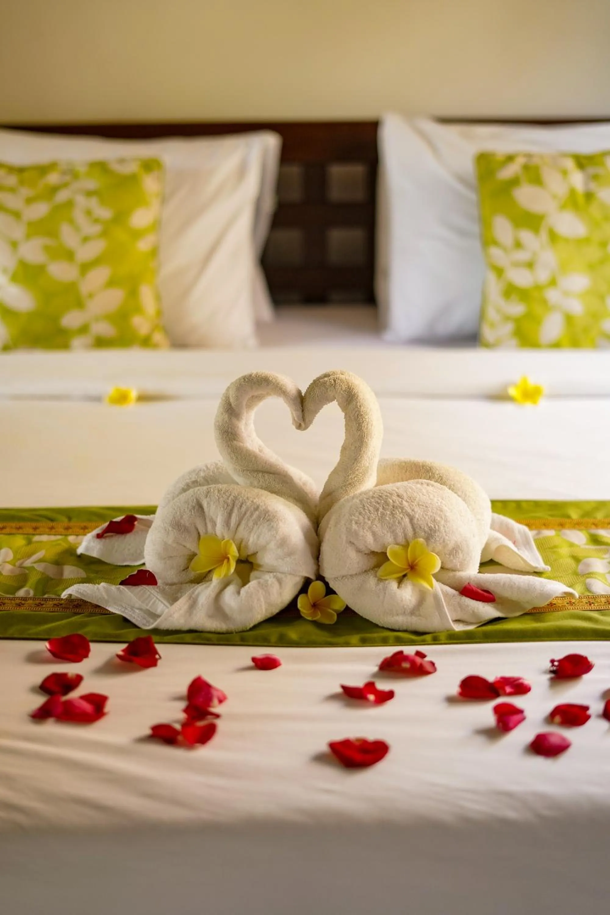 Bed in Three Brothers Bali Legian Bungalows & Villas