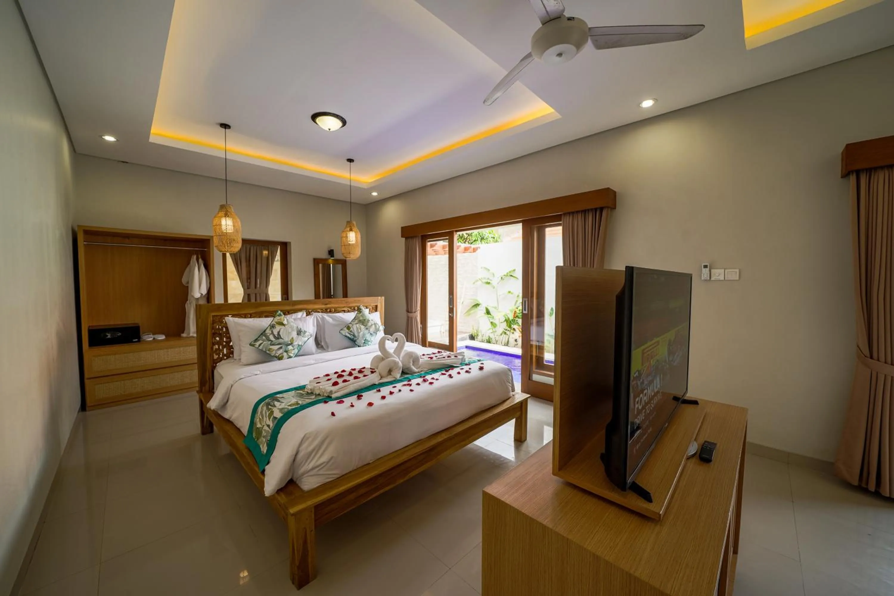 Bed in Three Brothers Bali Legian Bungalows & Villas