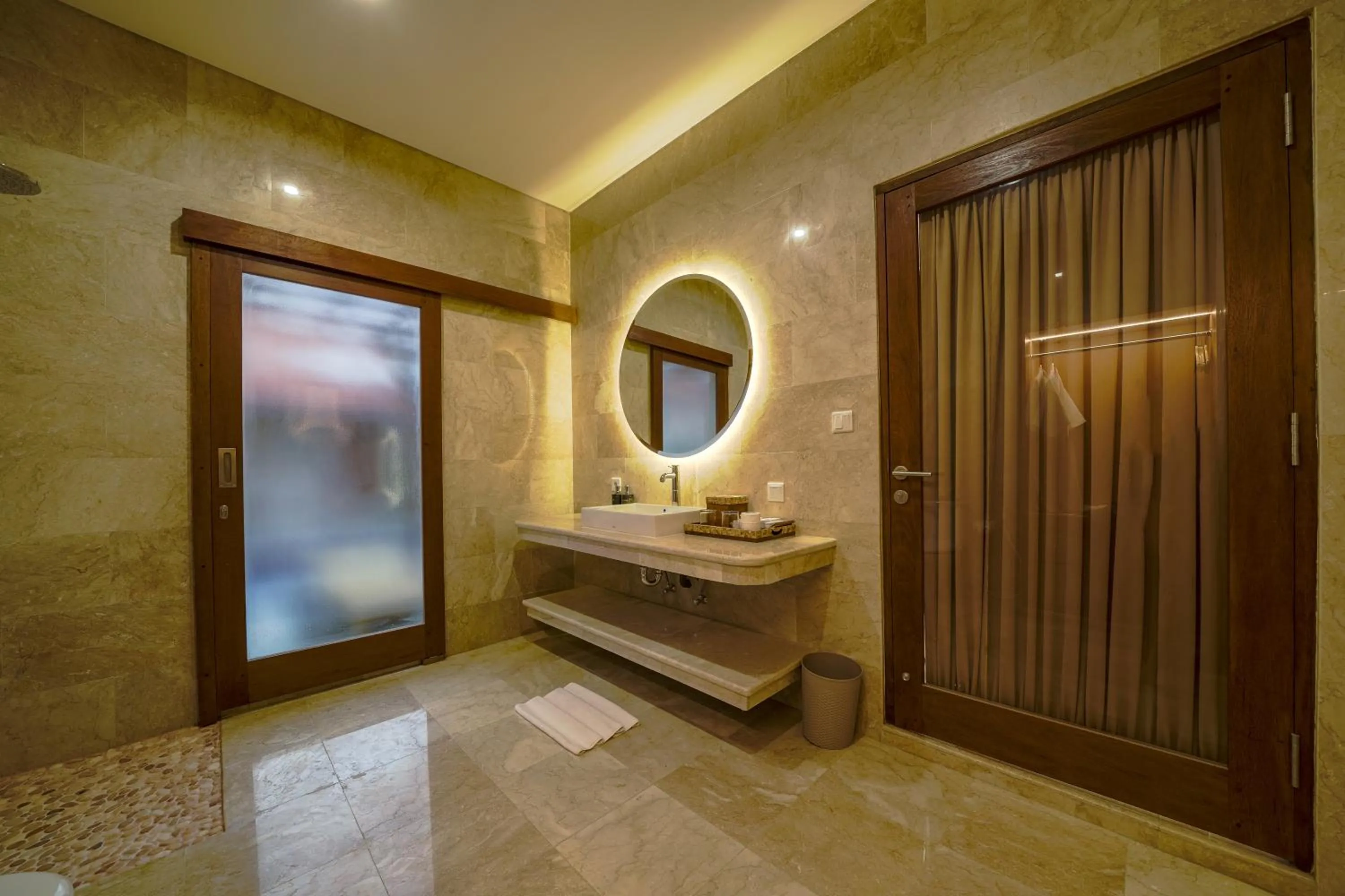 Bathroom in Three Brothers Bali Legian Bungalows & Villas