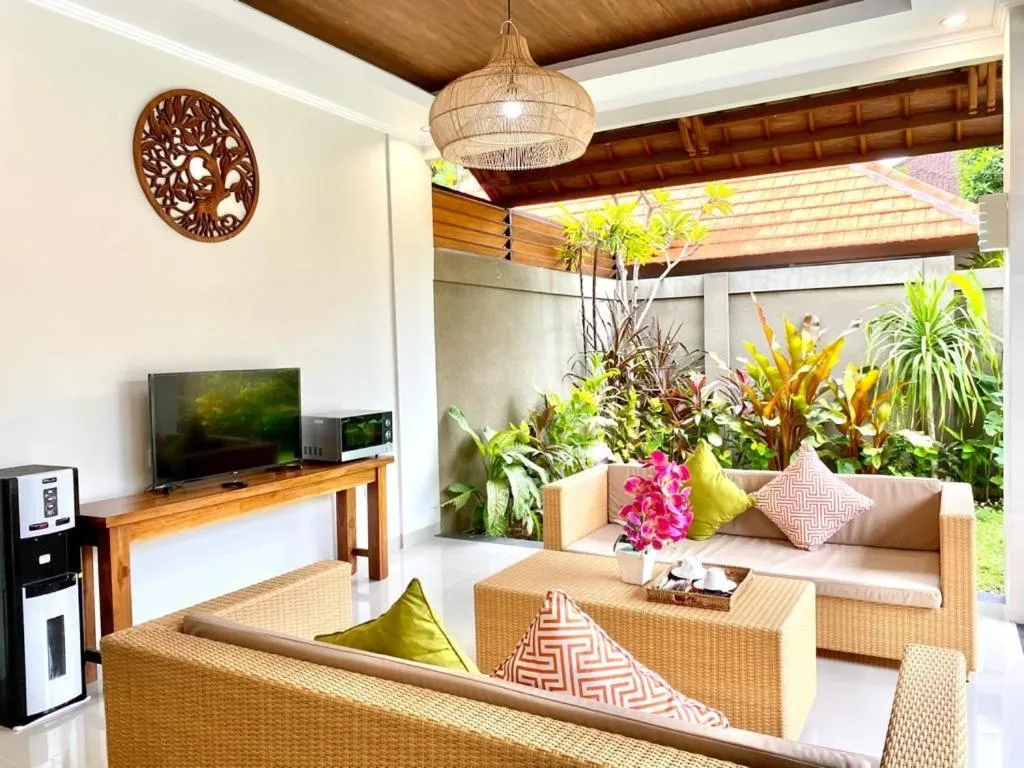 Communal lounge/ TV room in Three Brothers Bali Legian Bungalows & Villas