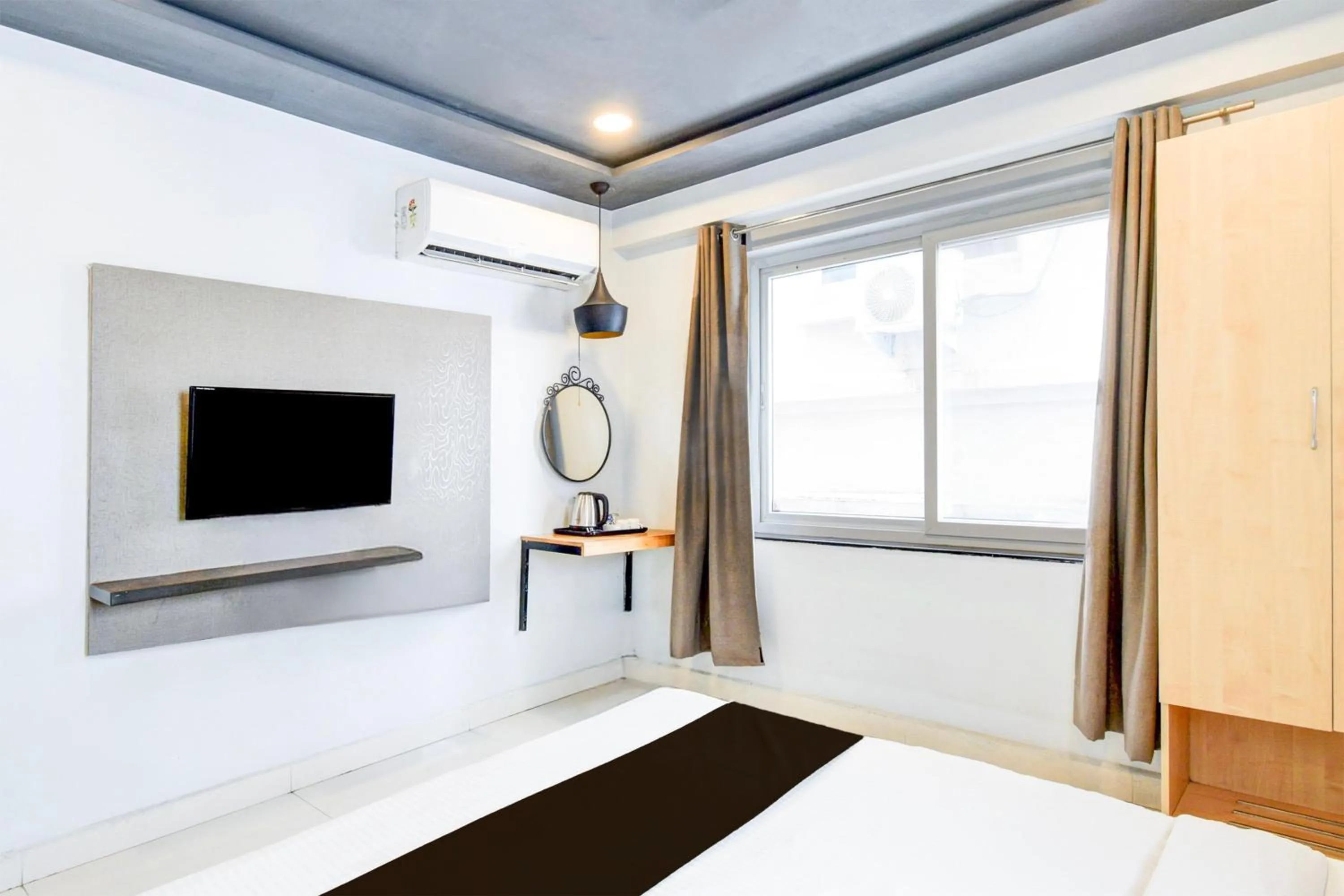 Bedroom, Bed in Super Townhouse HiTech city Hyderabad