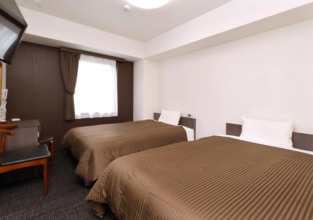 Photo of the whole room, Bed in Hotel Trend Okayama Ekimae