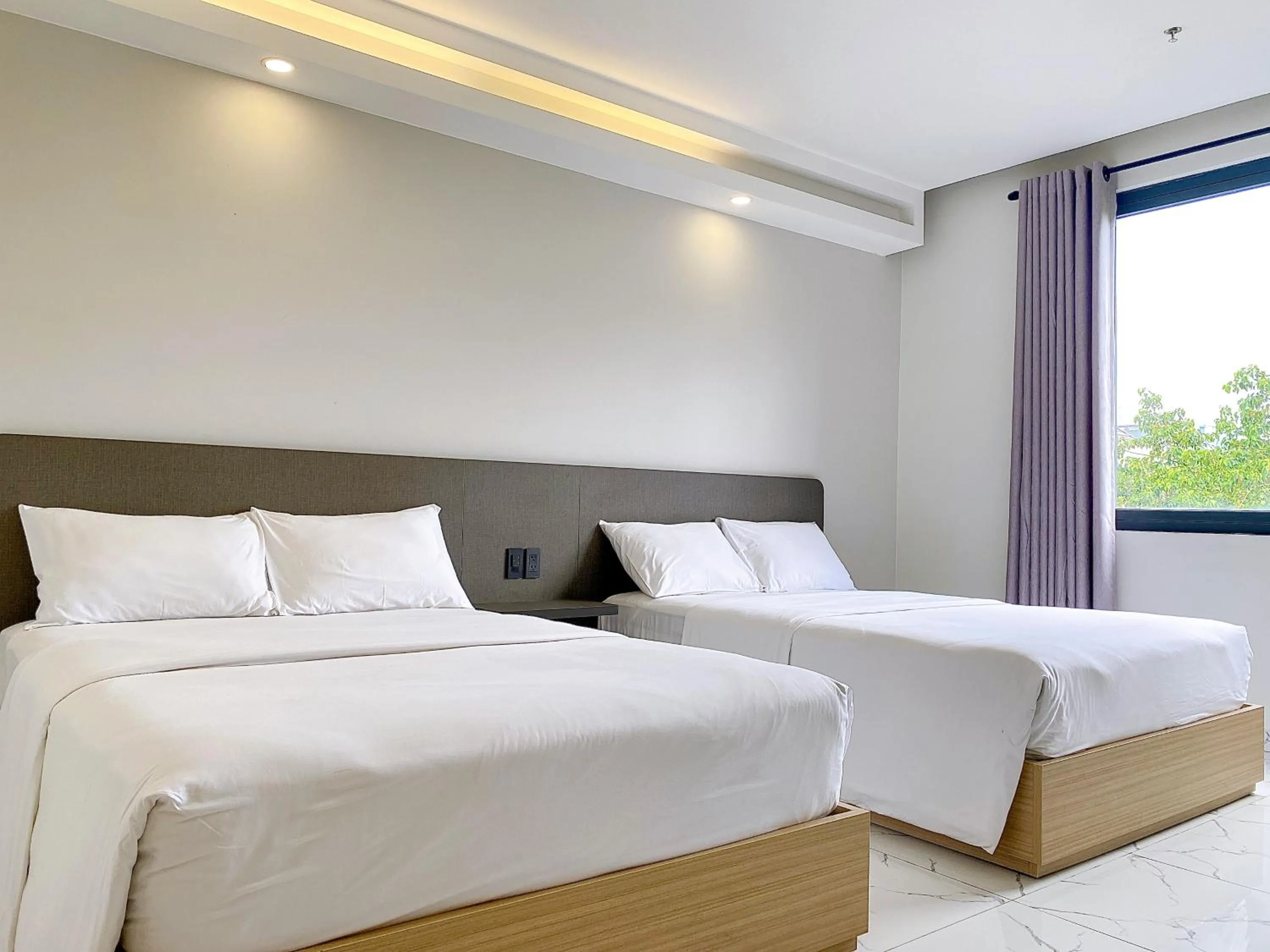 Bed in The Luxe Hotel Châu Đốc