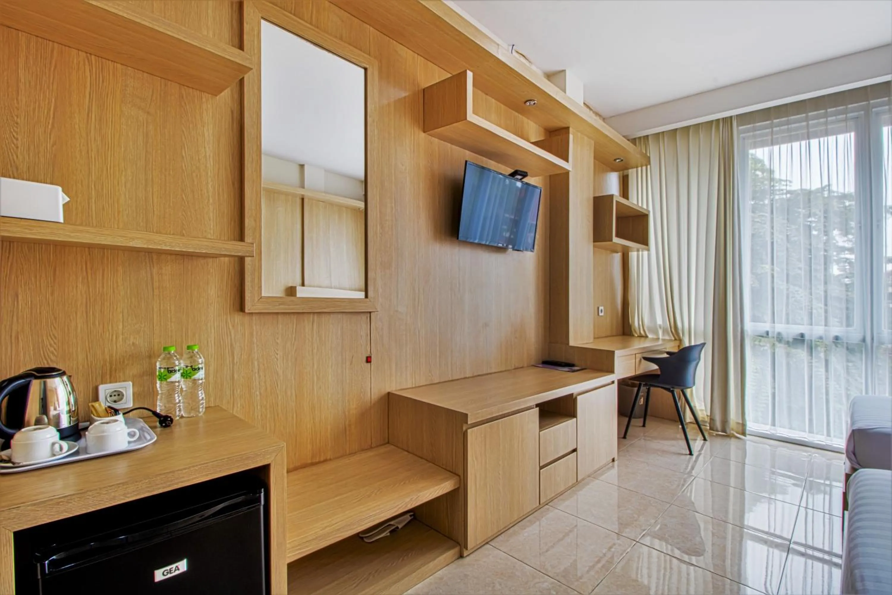 Bed, TV/Entertainment Center in D Padmaya Residence