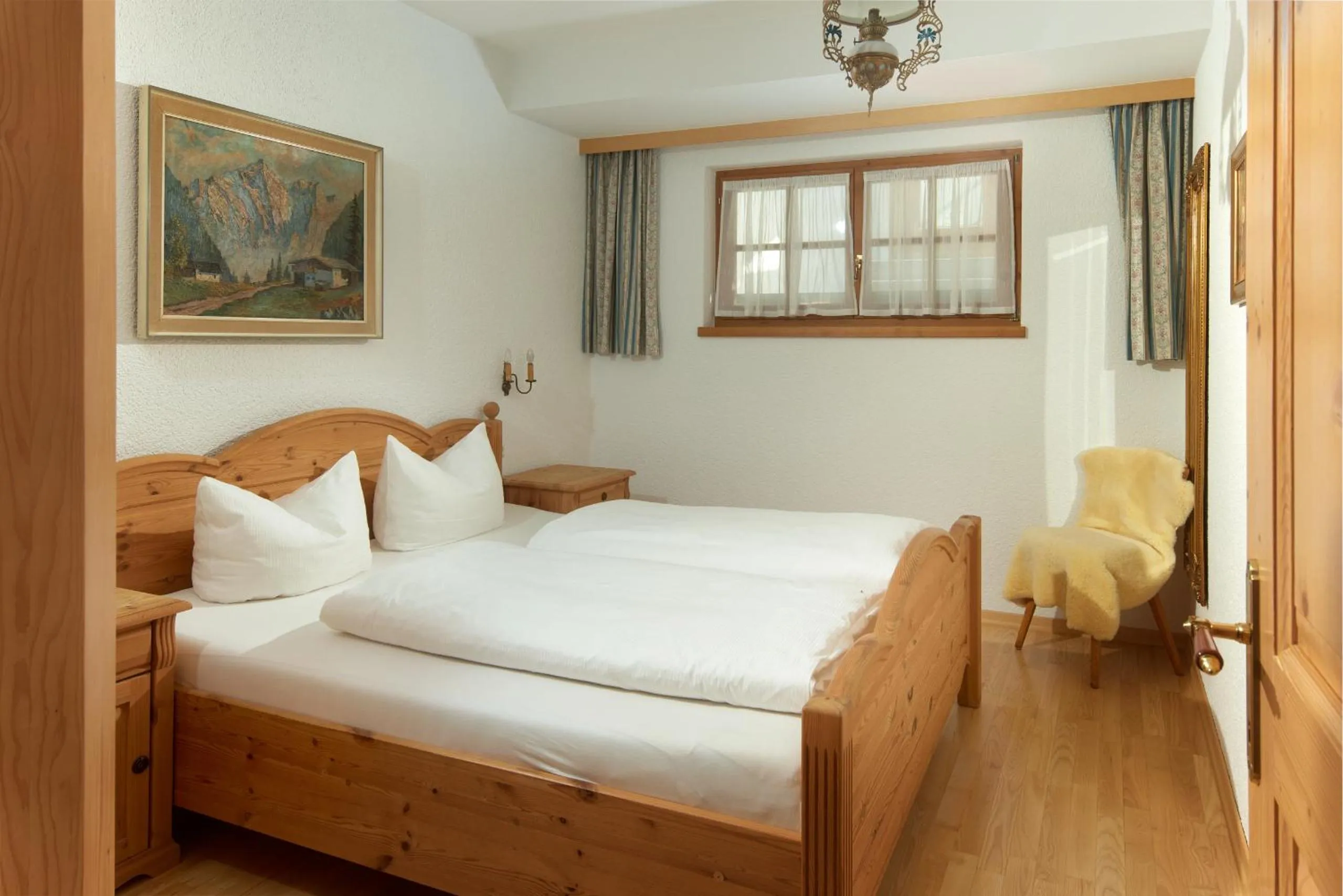 Bed in Alt Montafon Hotel Appartements by Pferd auf Wolke