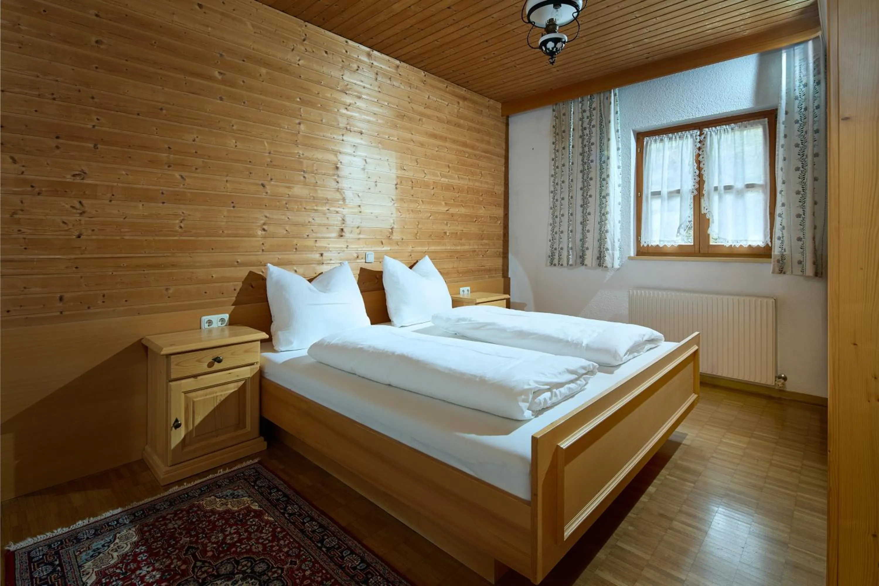 Bed in Alt Montafon Hotel Appartements by Pferd auf Wolke