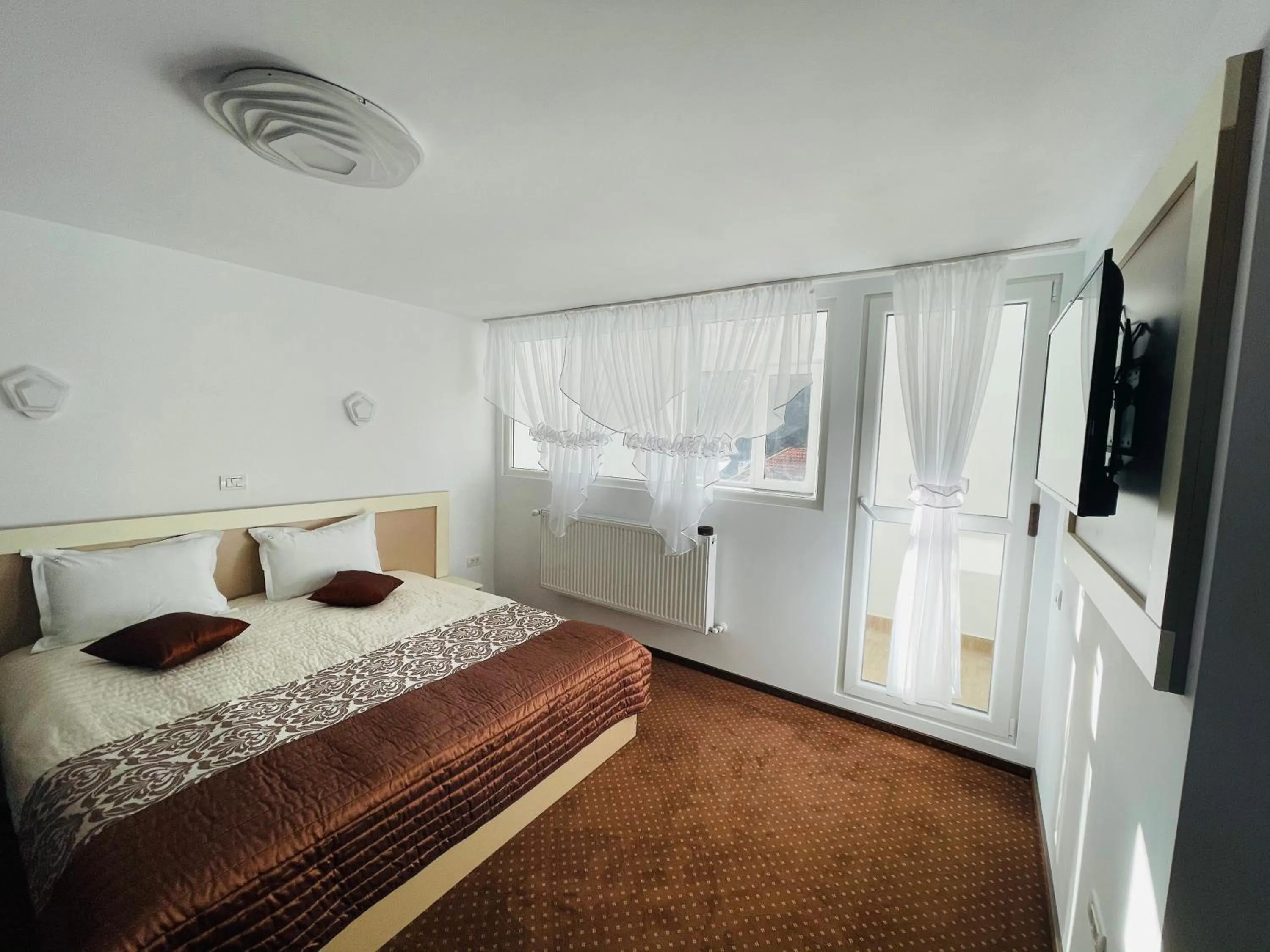 Bed in Pensiunea Sport