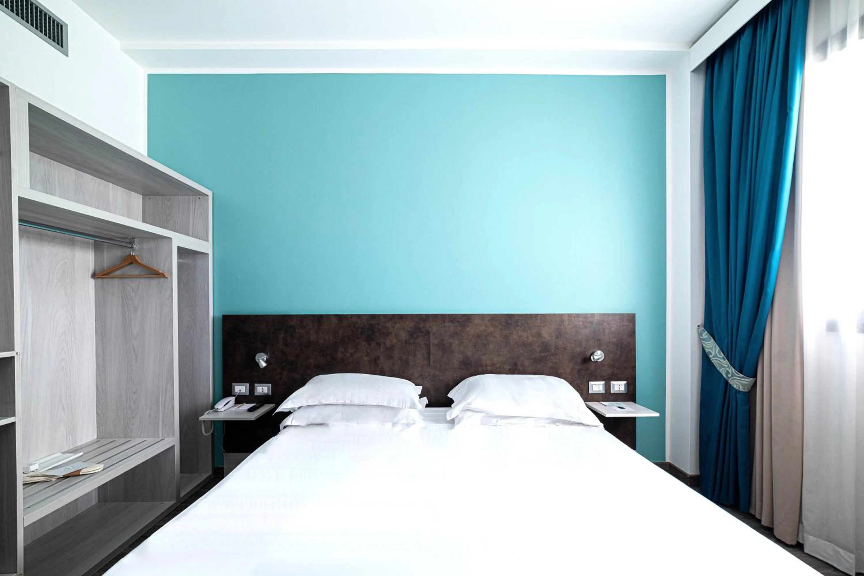 Bed in Phi Hotel Milano