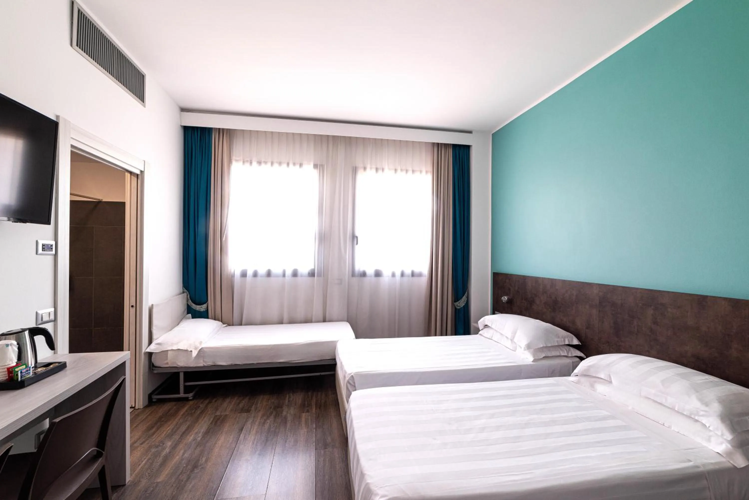 Bed in Phi Hotel Milano