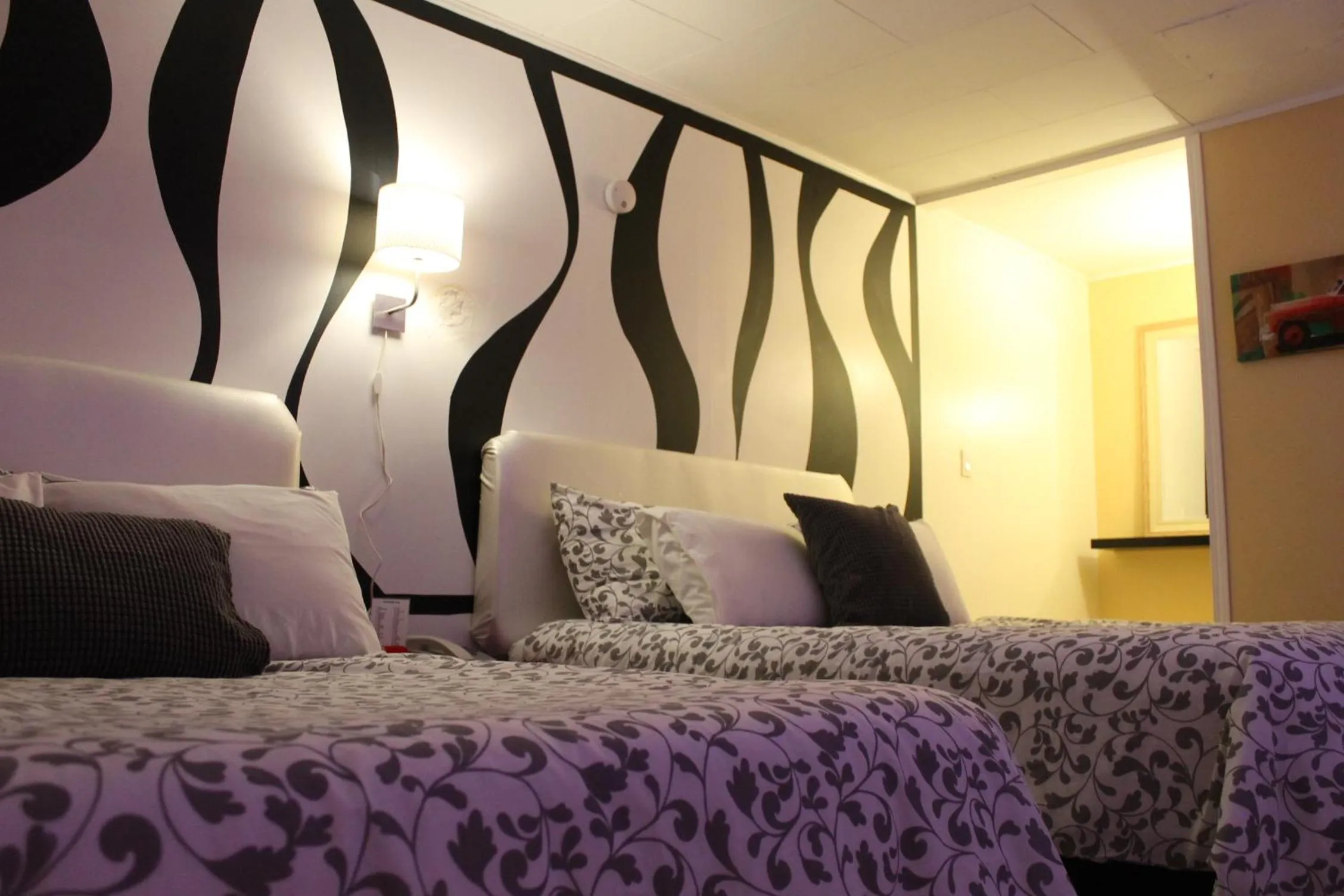 Bed in Sage Hills Motel