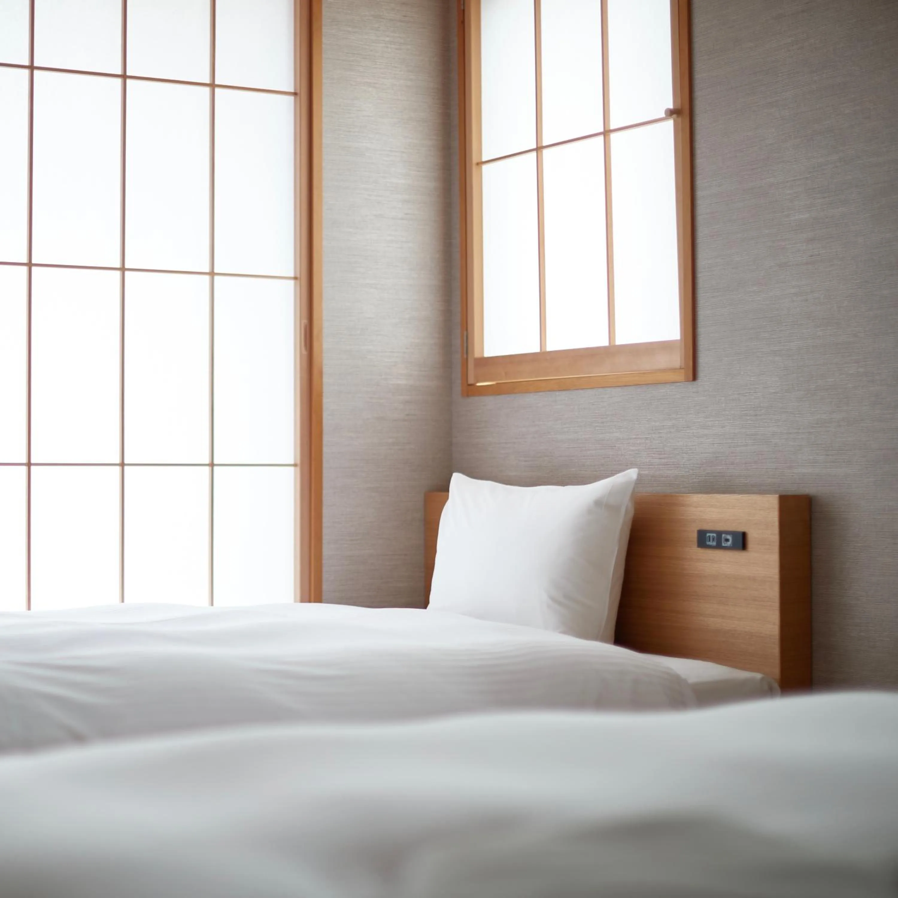 Bed in KAMAKURA Hotel