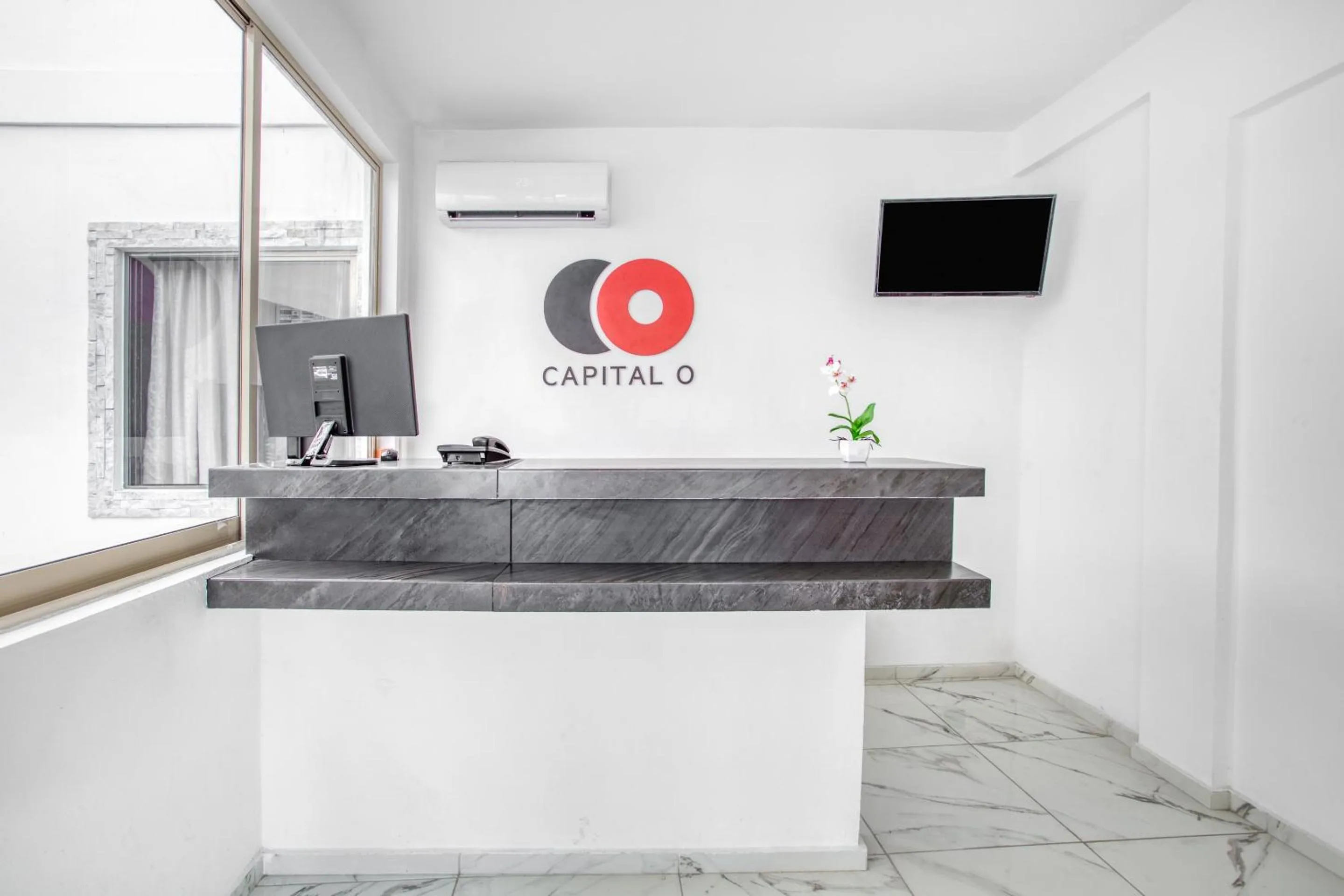 Lobby or reception in Capital O Hotel Yukon