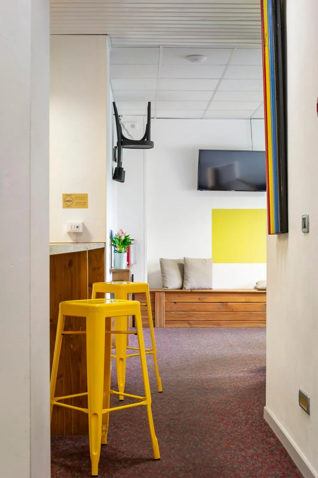 Communal lounge/ TV room in UniHo Hostel