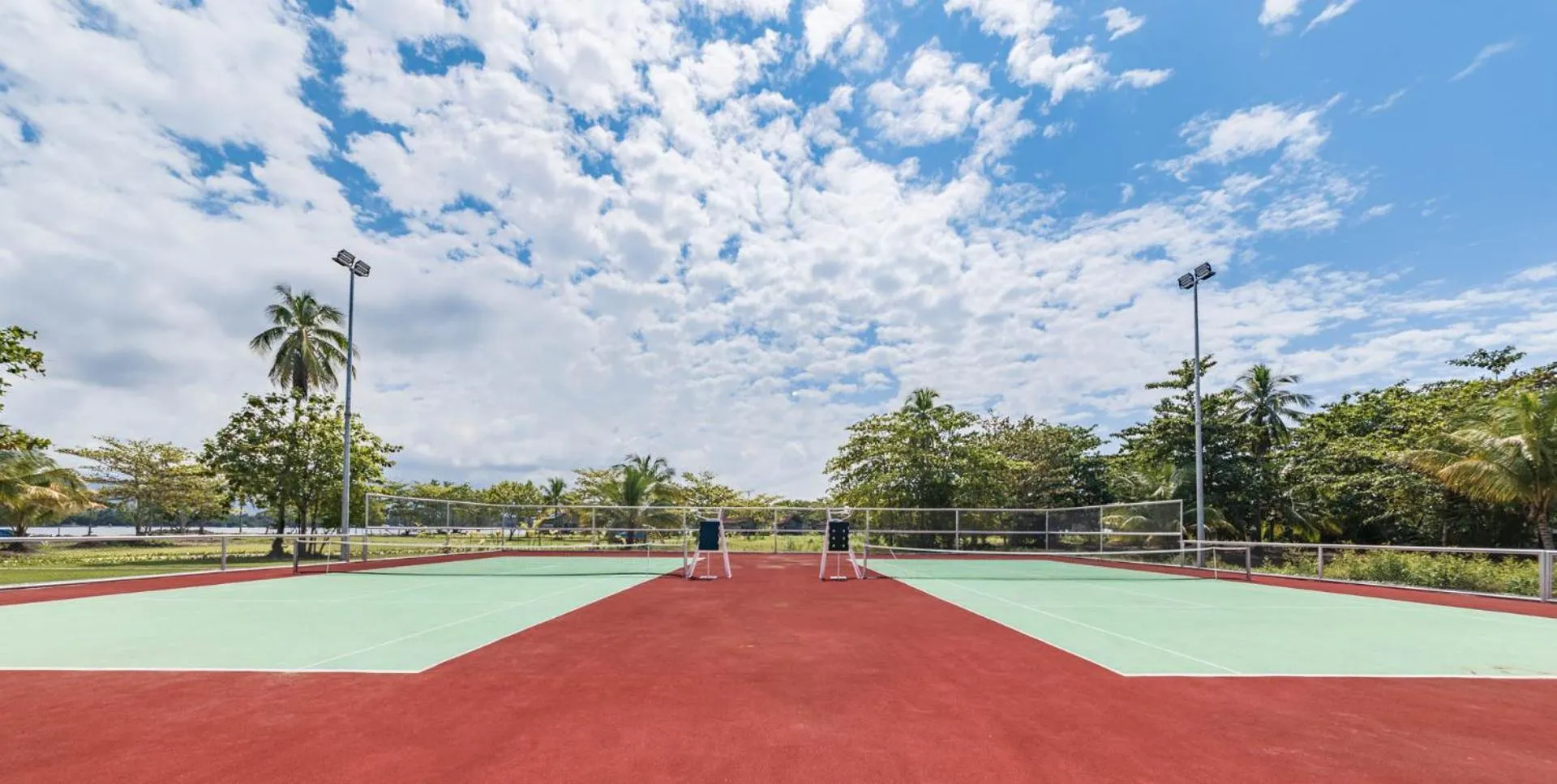 Tennis court in Dusit Thani Lubi Plantation Resort