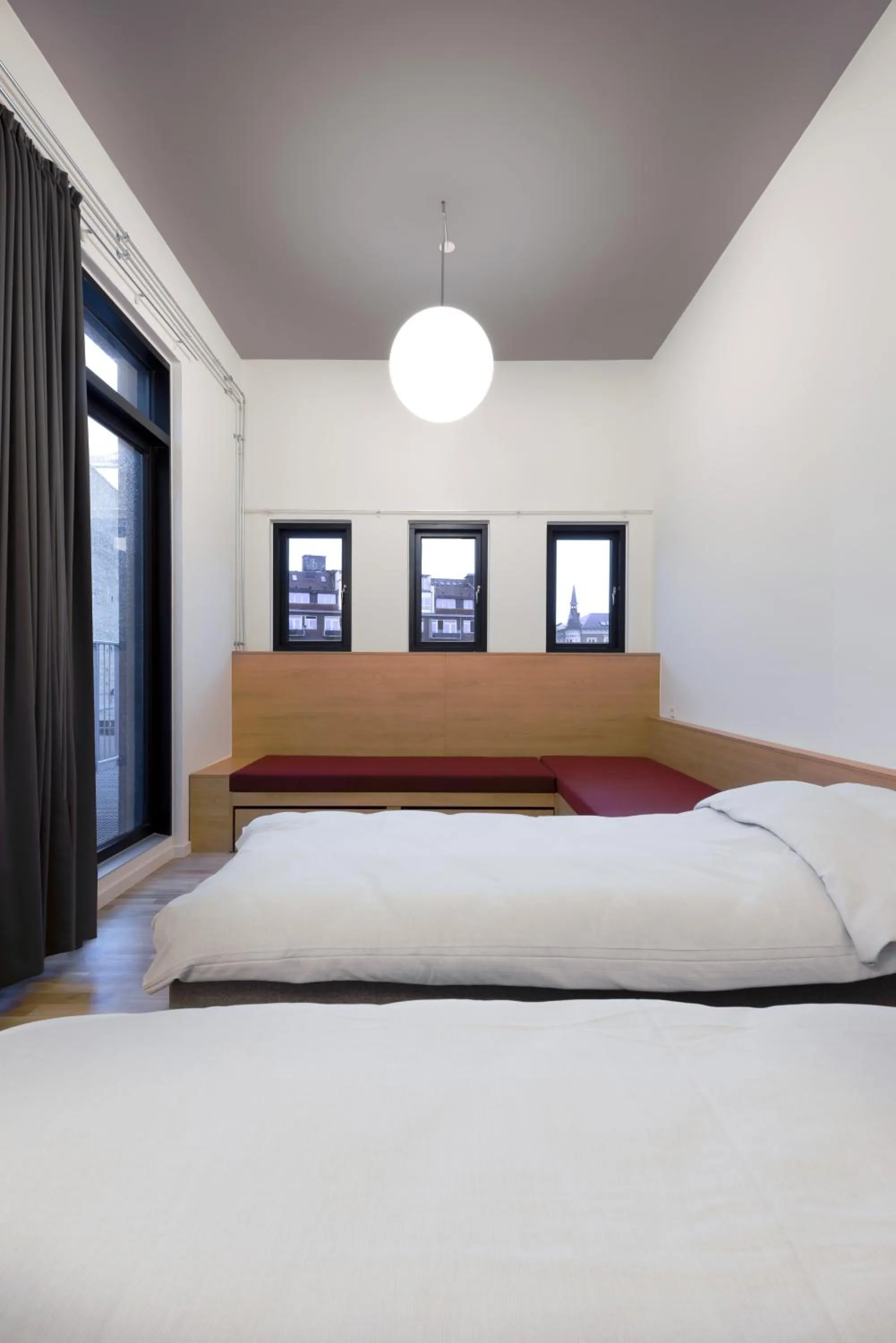 Bed in BOOK1 by Brøchner Hotels