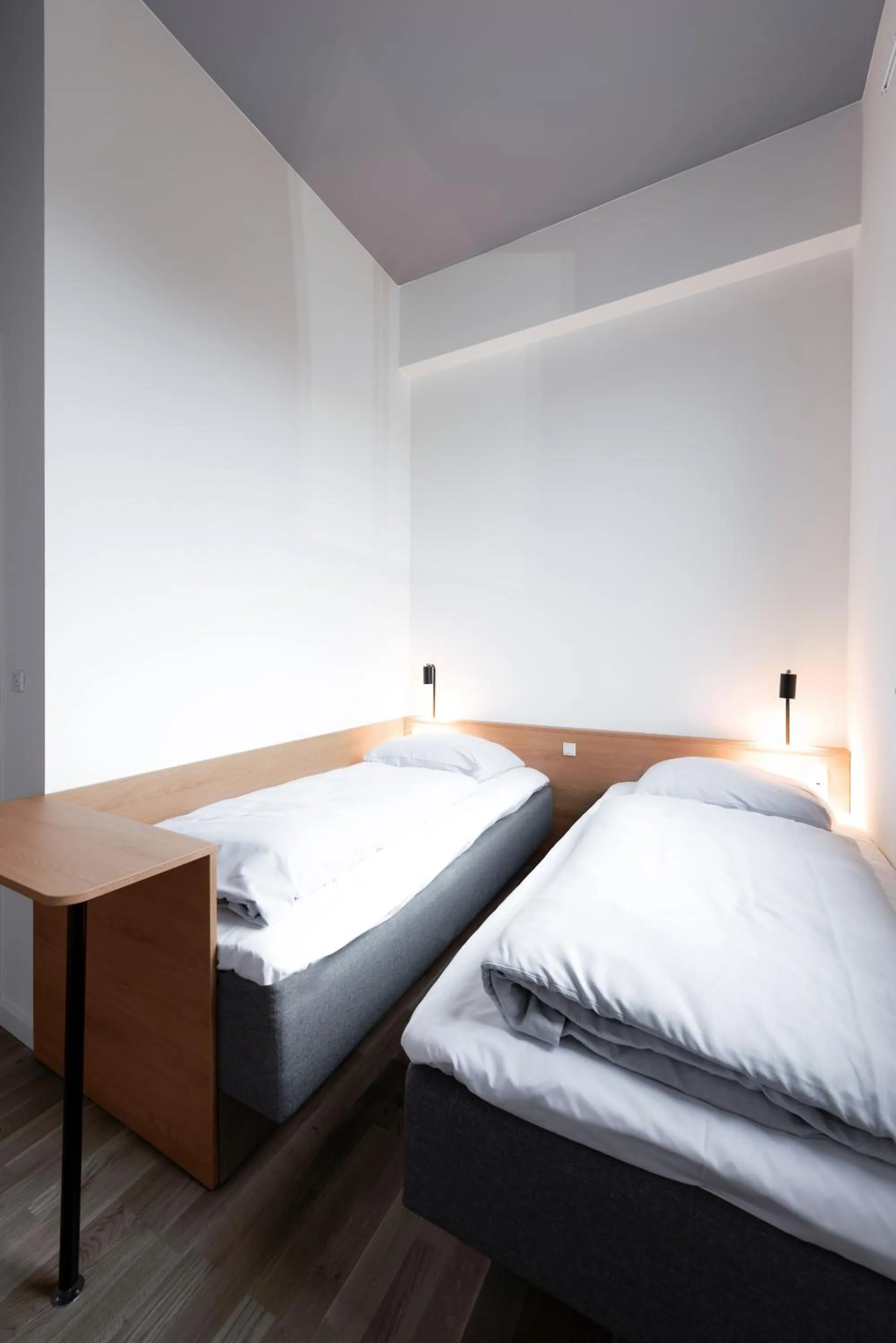 Bed in BOOK1 by Brøchner Hotels