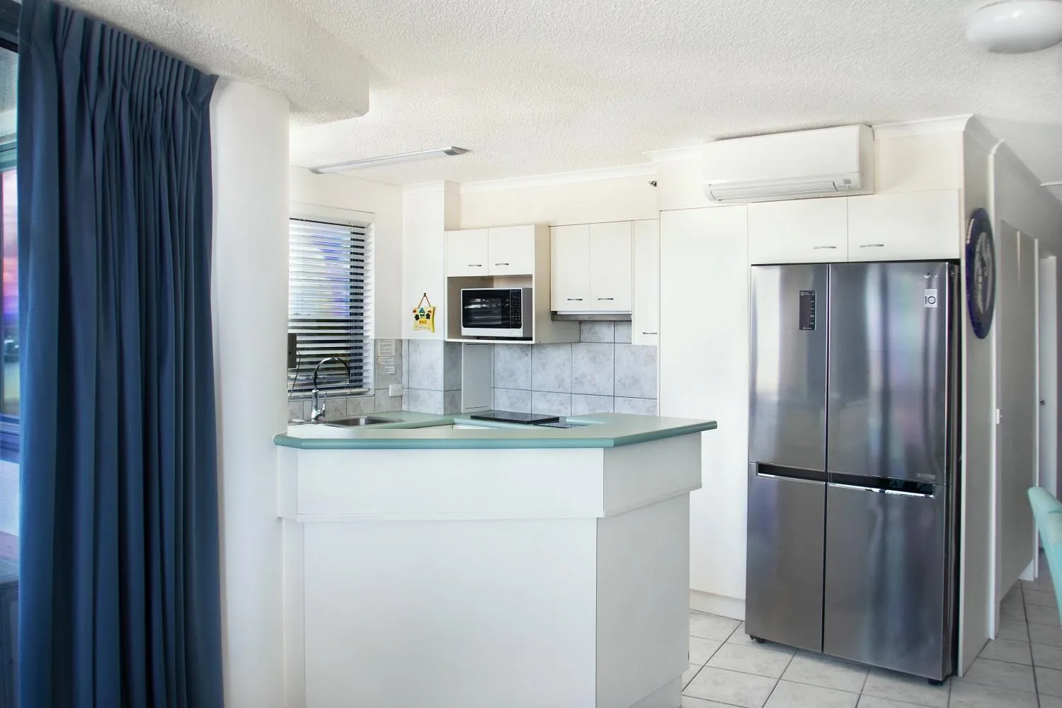 Kitchen or kitchenette in Centrepoint Apartments Caloundra