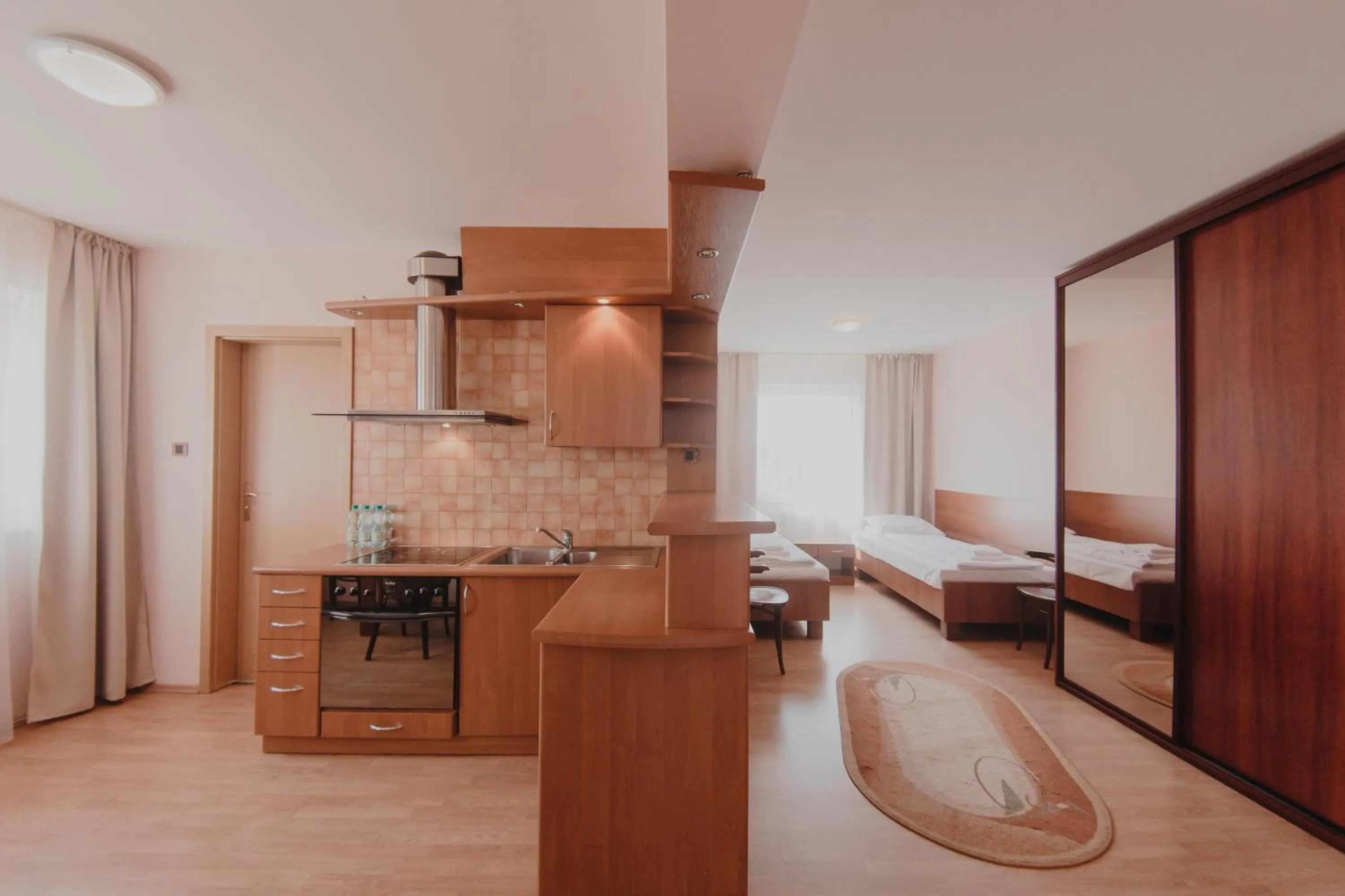 Kitchen or kitchenette, Bed in Hotel Cesarski - Kaiserhof