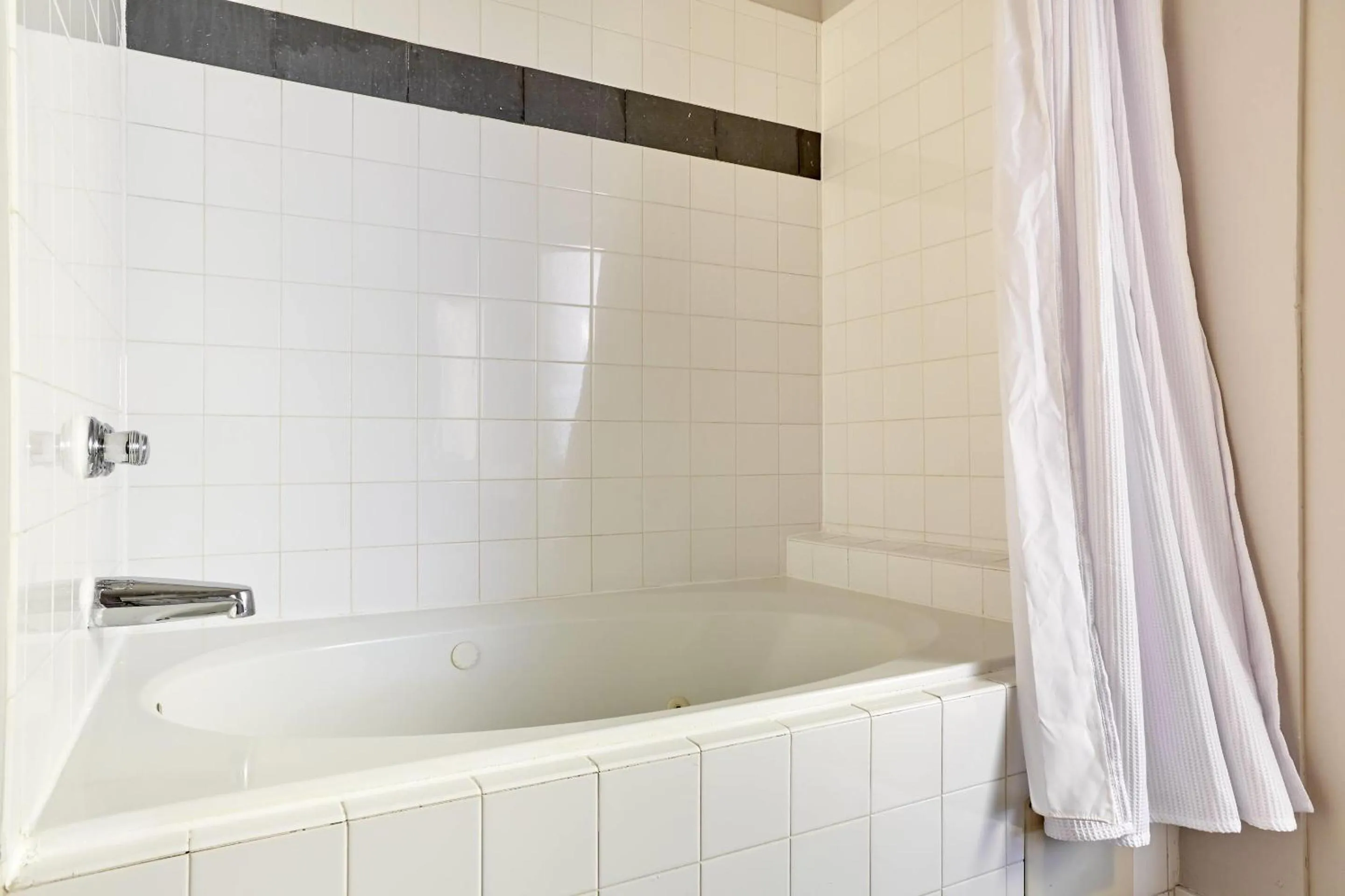 Bathroom in Reside Houston Downtown, a Wyndham Residence