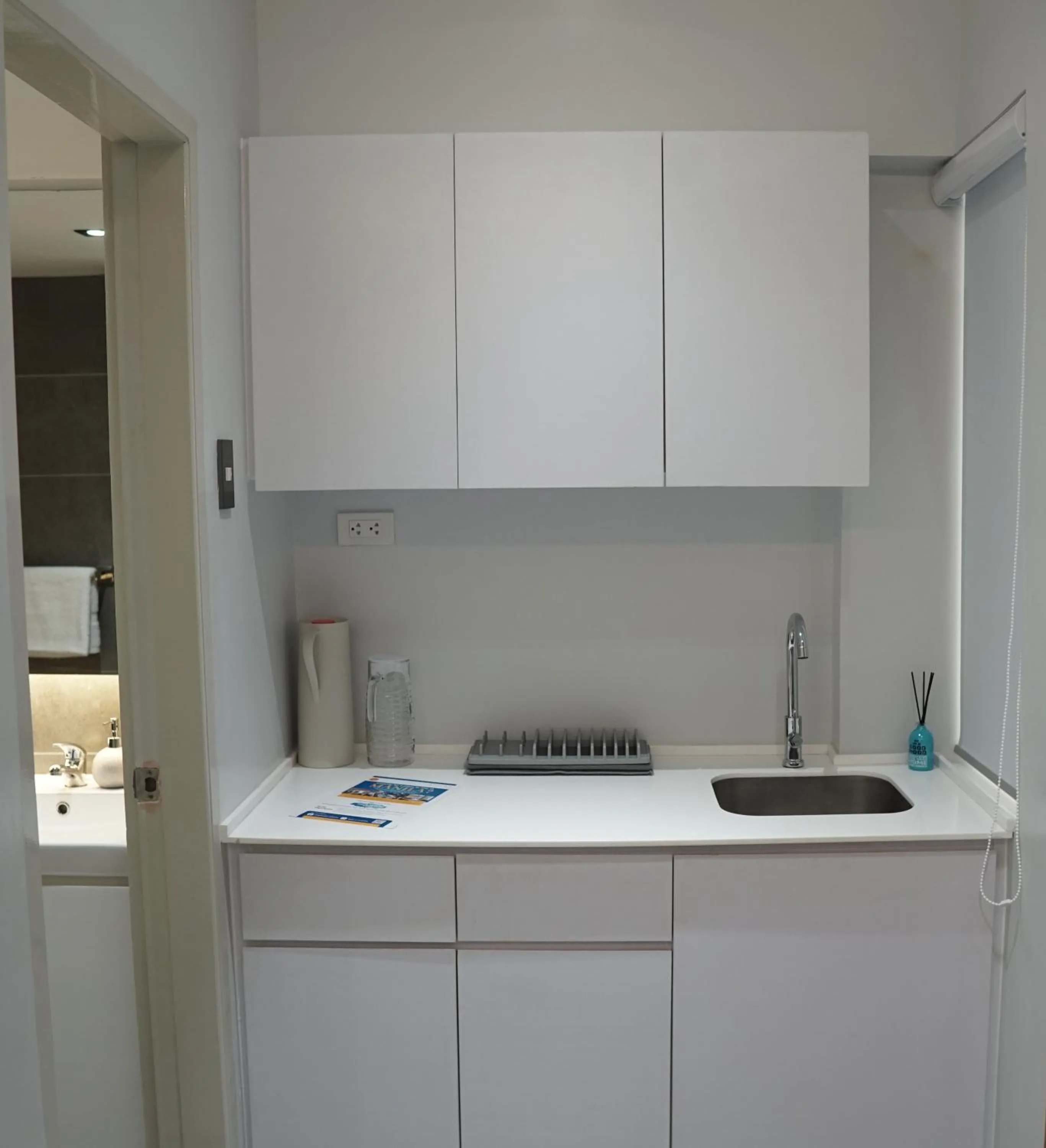 Kitchen or kitchenette in Radlett Residences Hotel - Tuguegarao