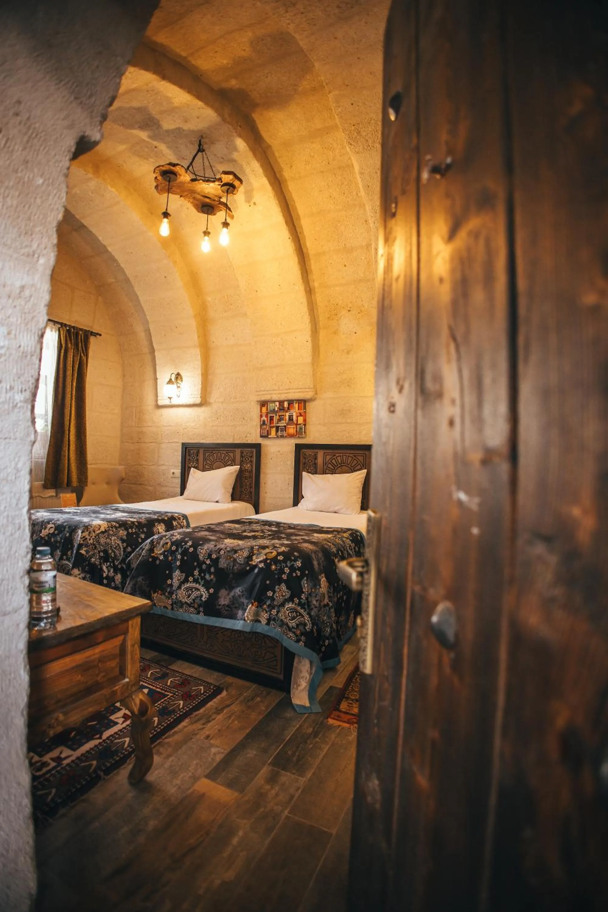 Bed in Vintage Cave House Hotel