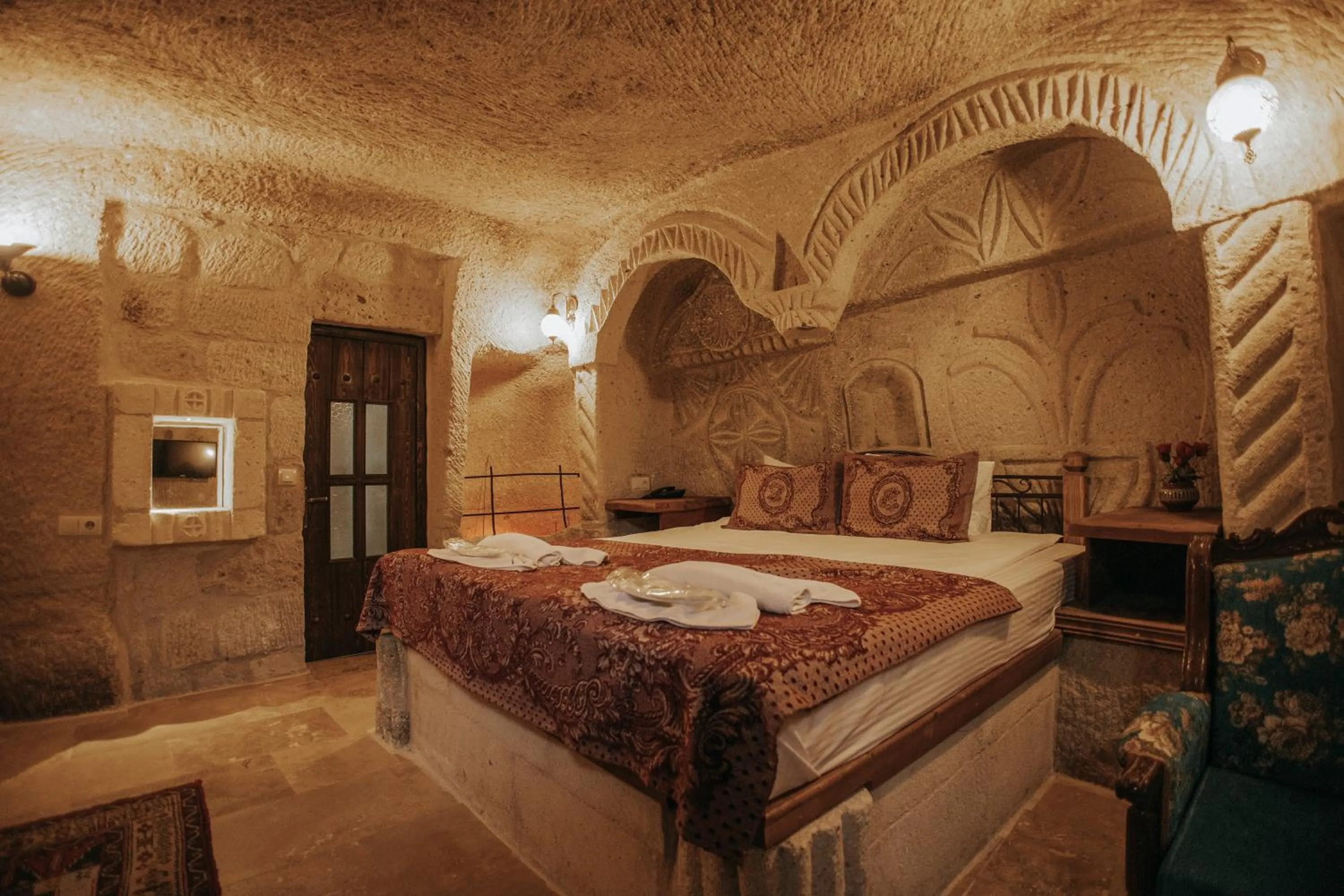 Bed in Vintage Cave House Hotel