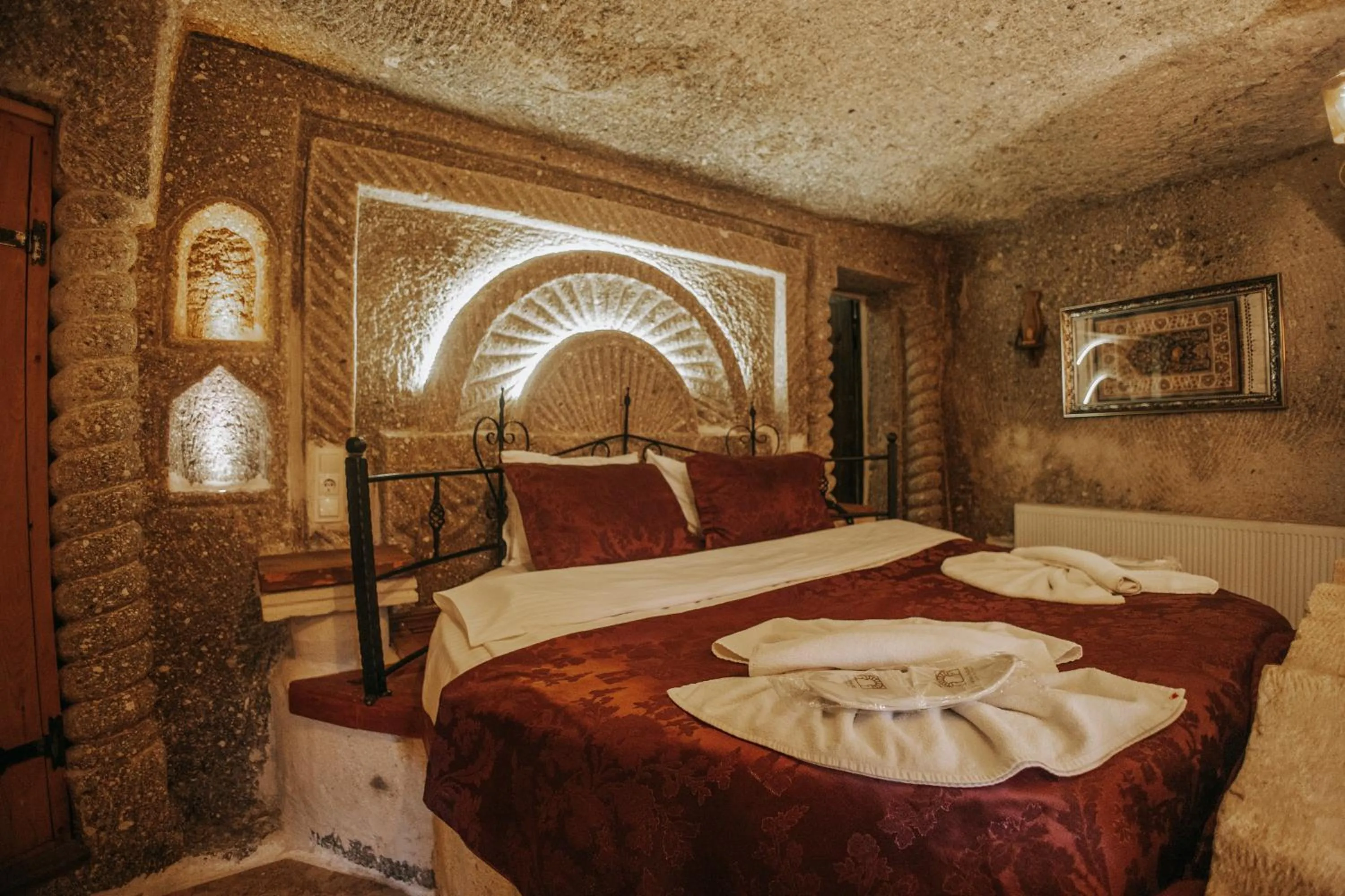 Bed in Vintage Cave House Hotel