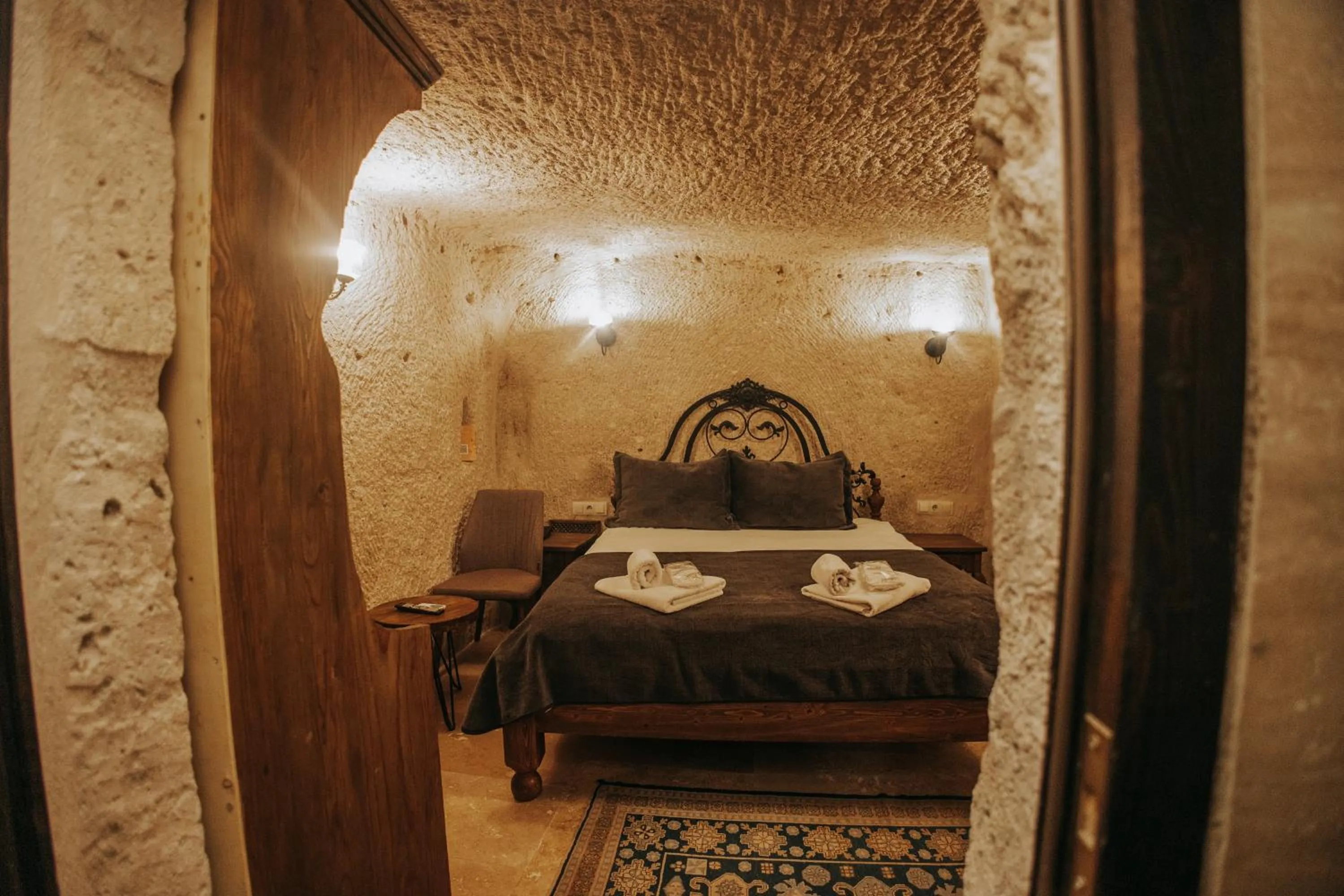 Bed in Vintage Cave House Hotel