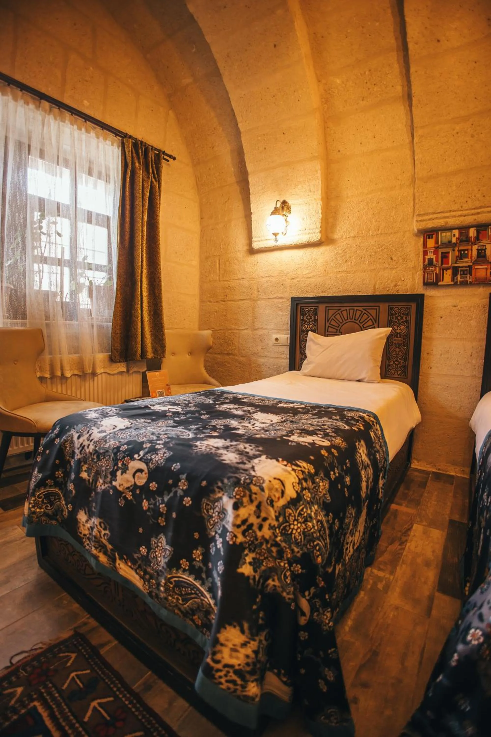 Bed in Vintage Cave House Hotel