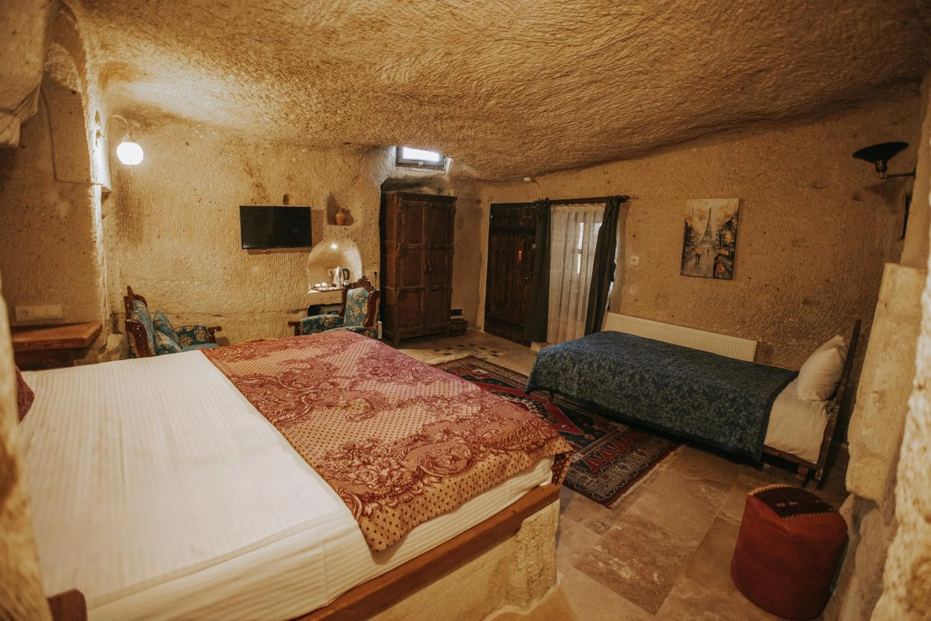 Bed in Vintage Cave House Hotel
