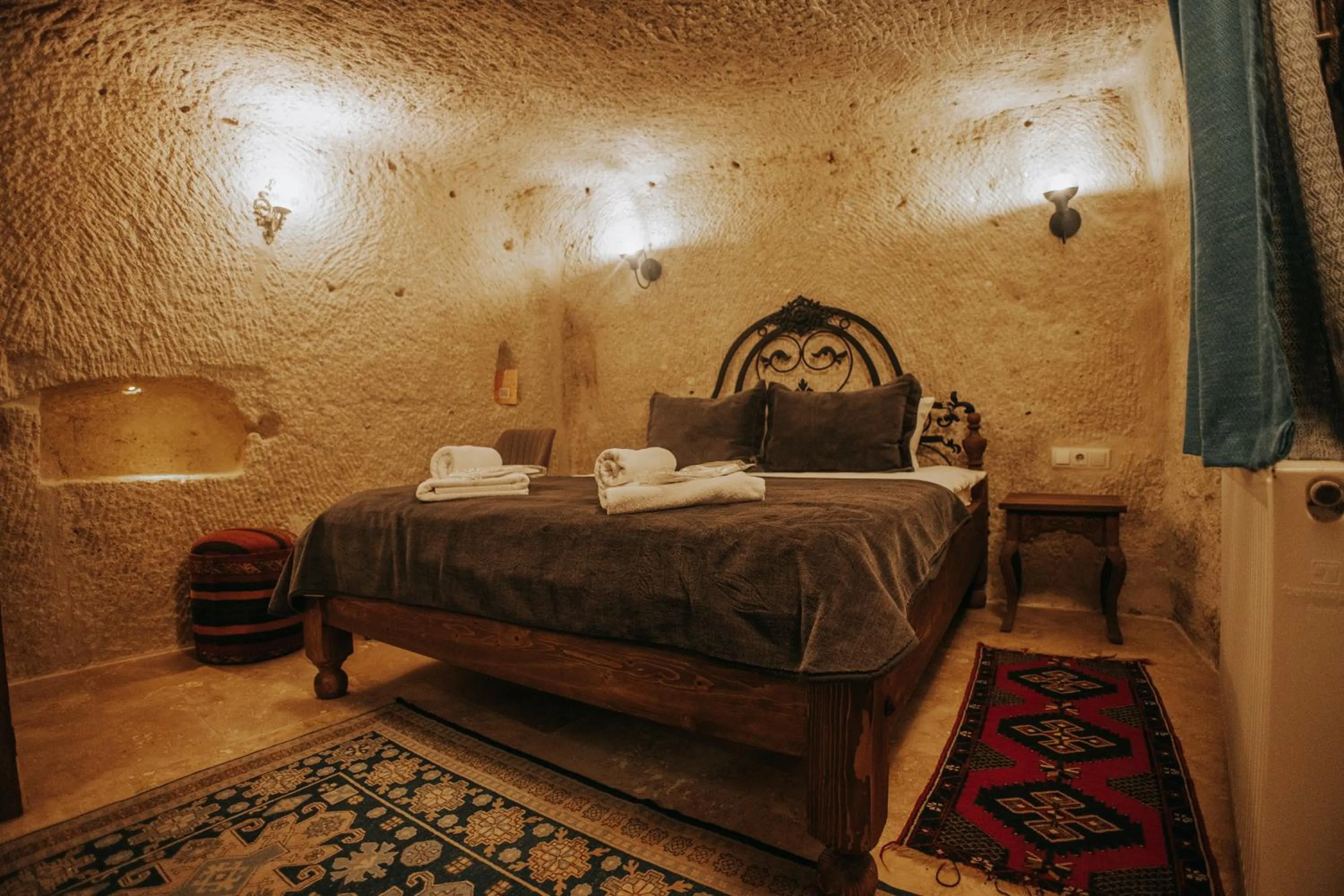 Bed in Vintage Cave House Hotel
