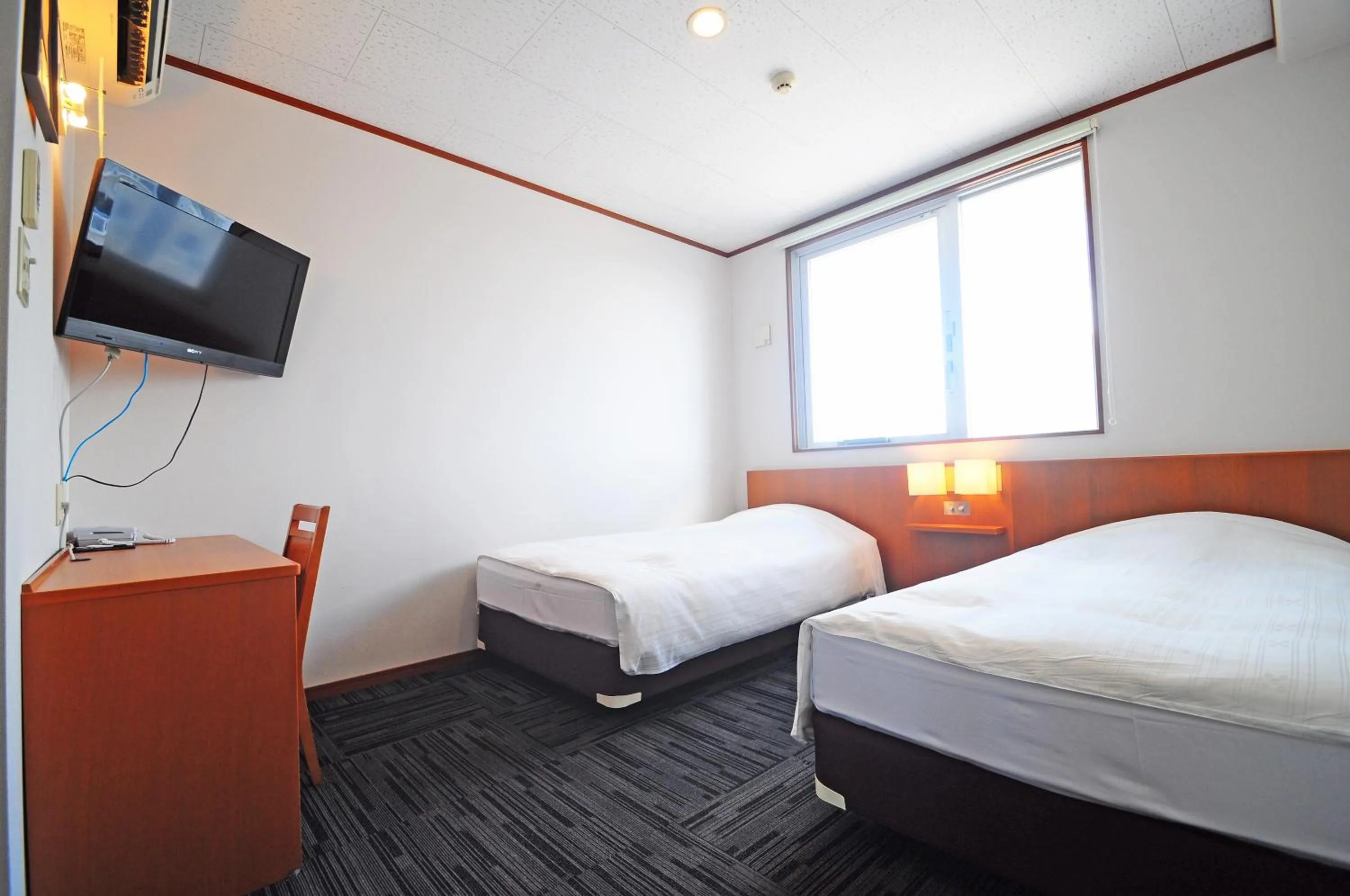 Photo of the whole room, Bed in Hotel Tulip Ishigakijima