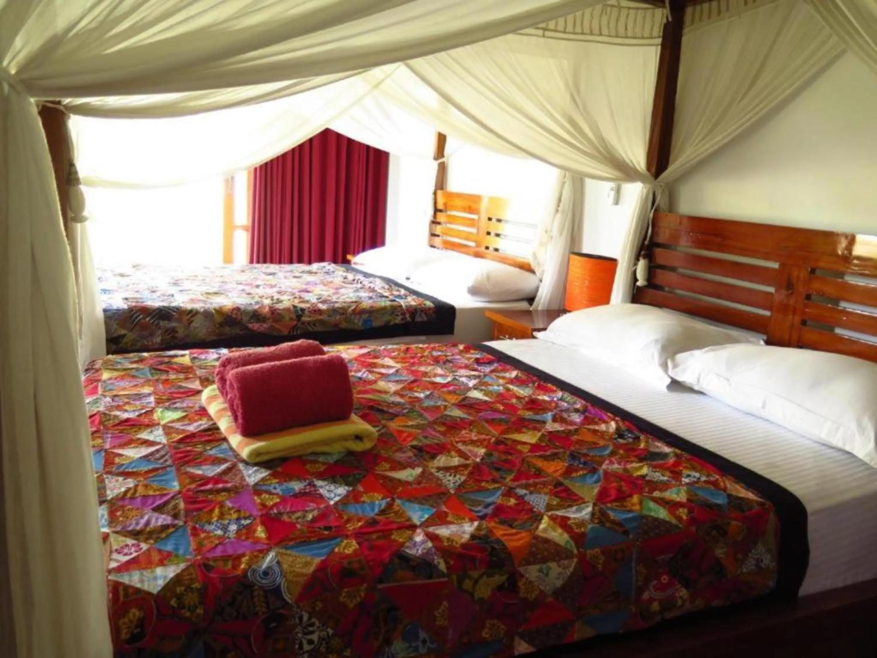 Bed in Sunia Loka Bungalows & Dive Center