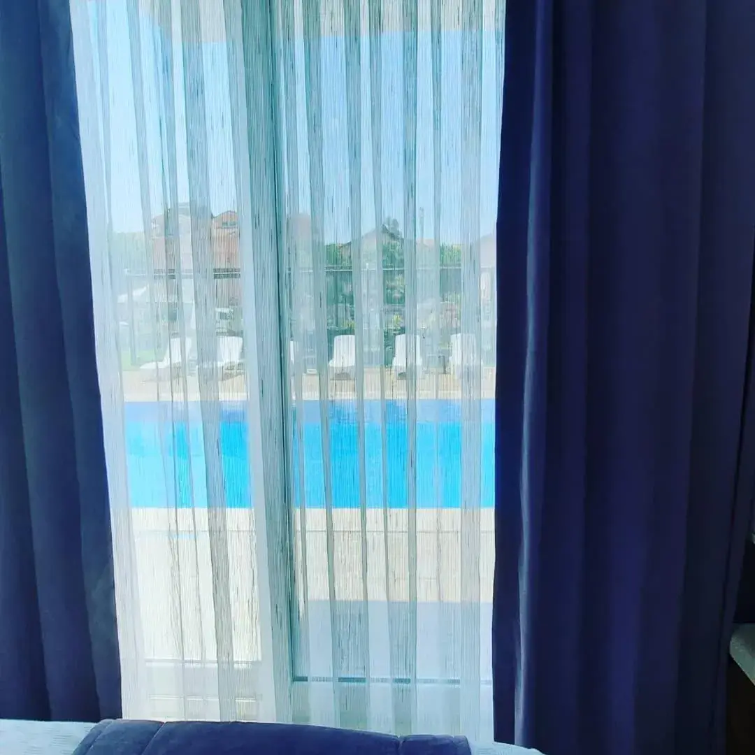 Triple Room with Garden View in Vespera hotel Triple Room with Garden View in Vespera hotel