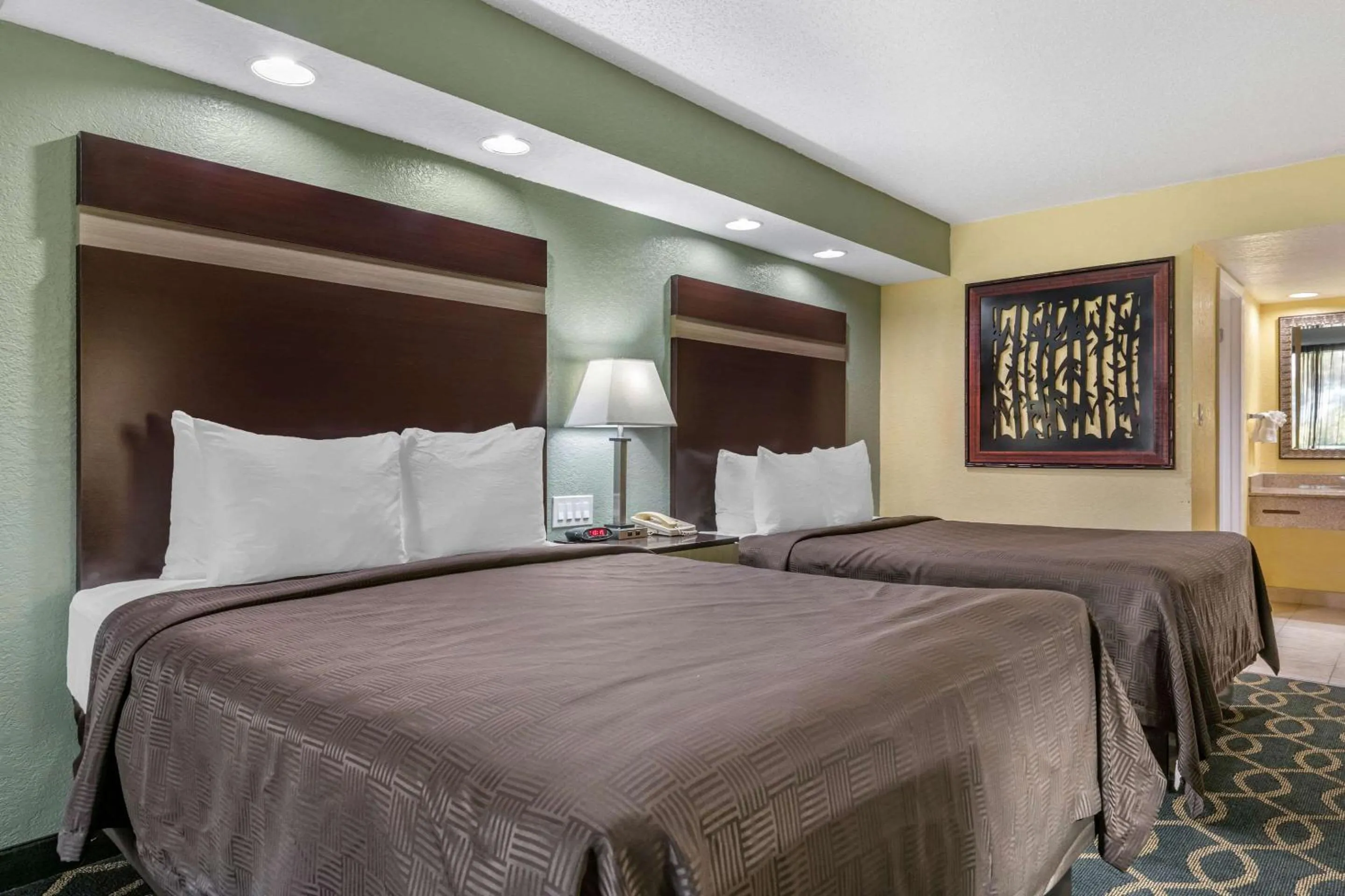 Bedroom, Bed in Clarion Inn Orlando International Drive - ICON Park