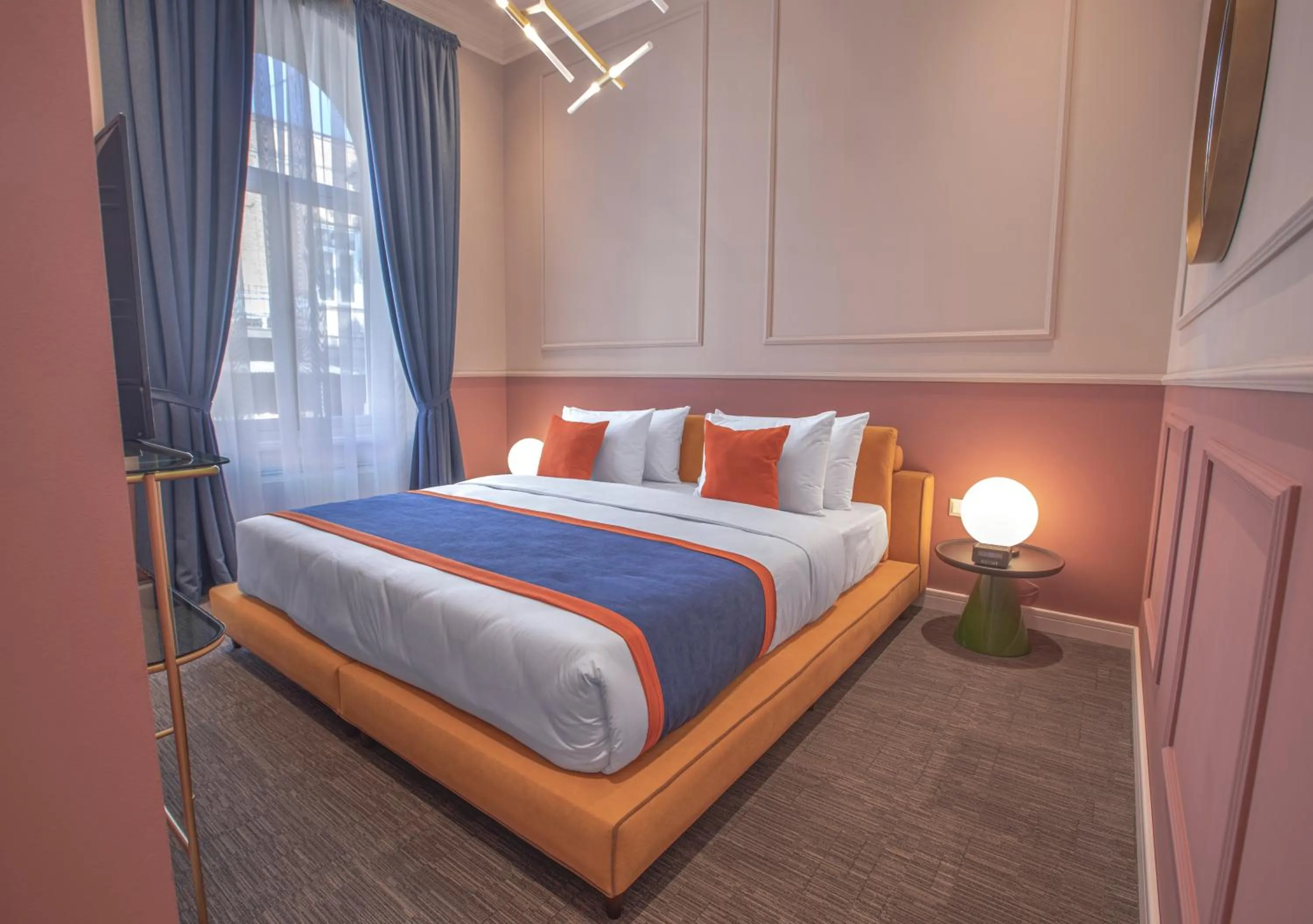 Bed in Heritage Hotel and Suites