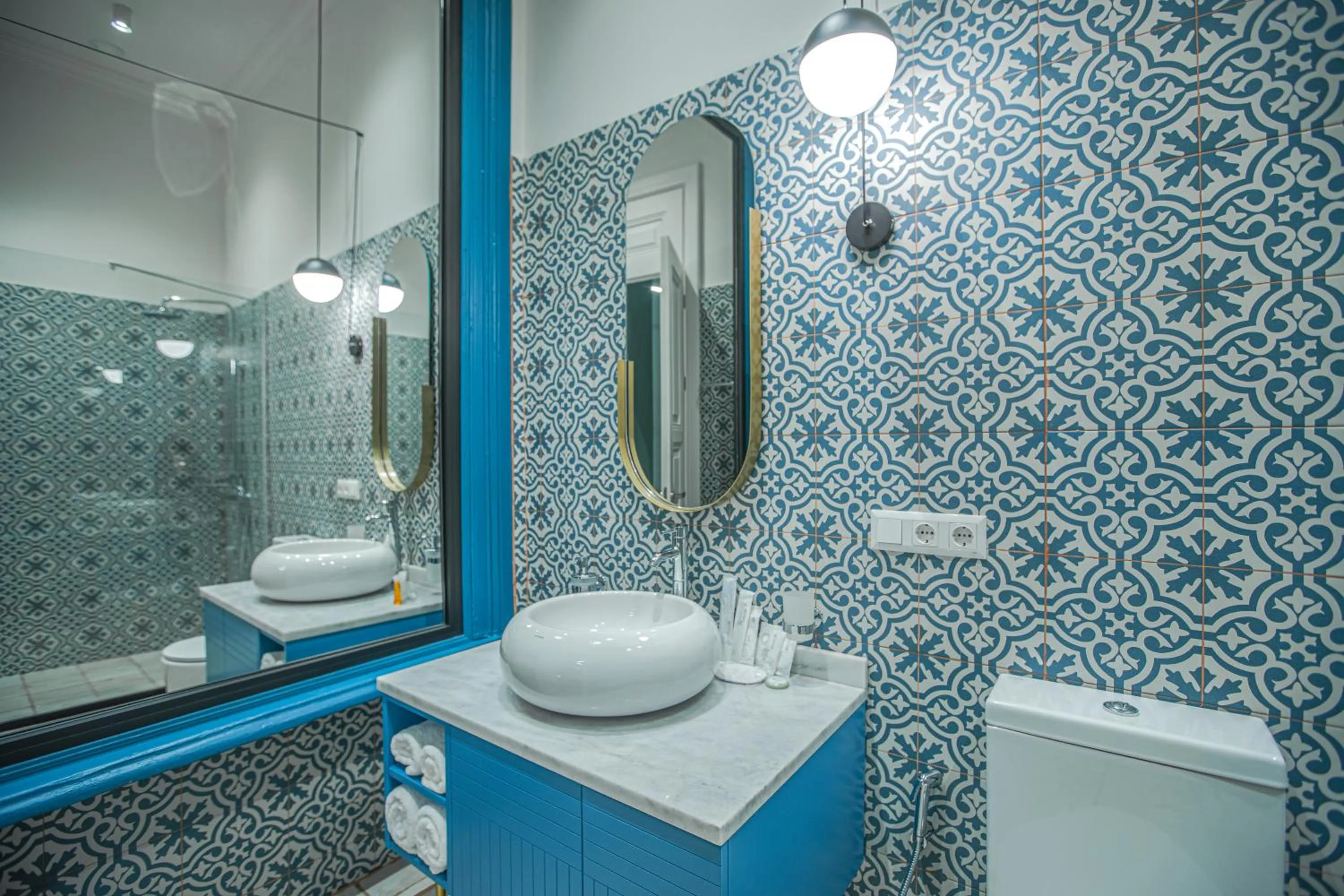 Bathroom in Heritage Hotel and Suites