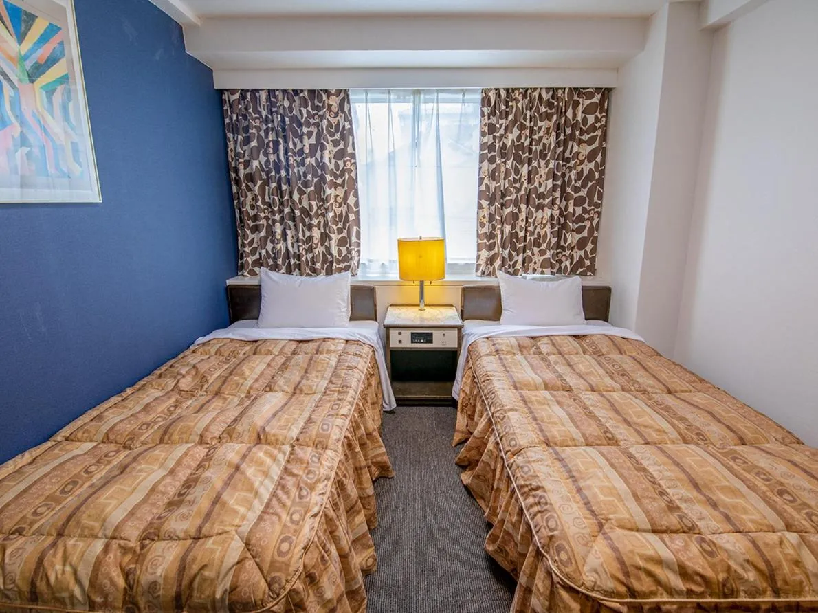 Bed in Hotel Koryukaku