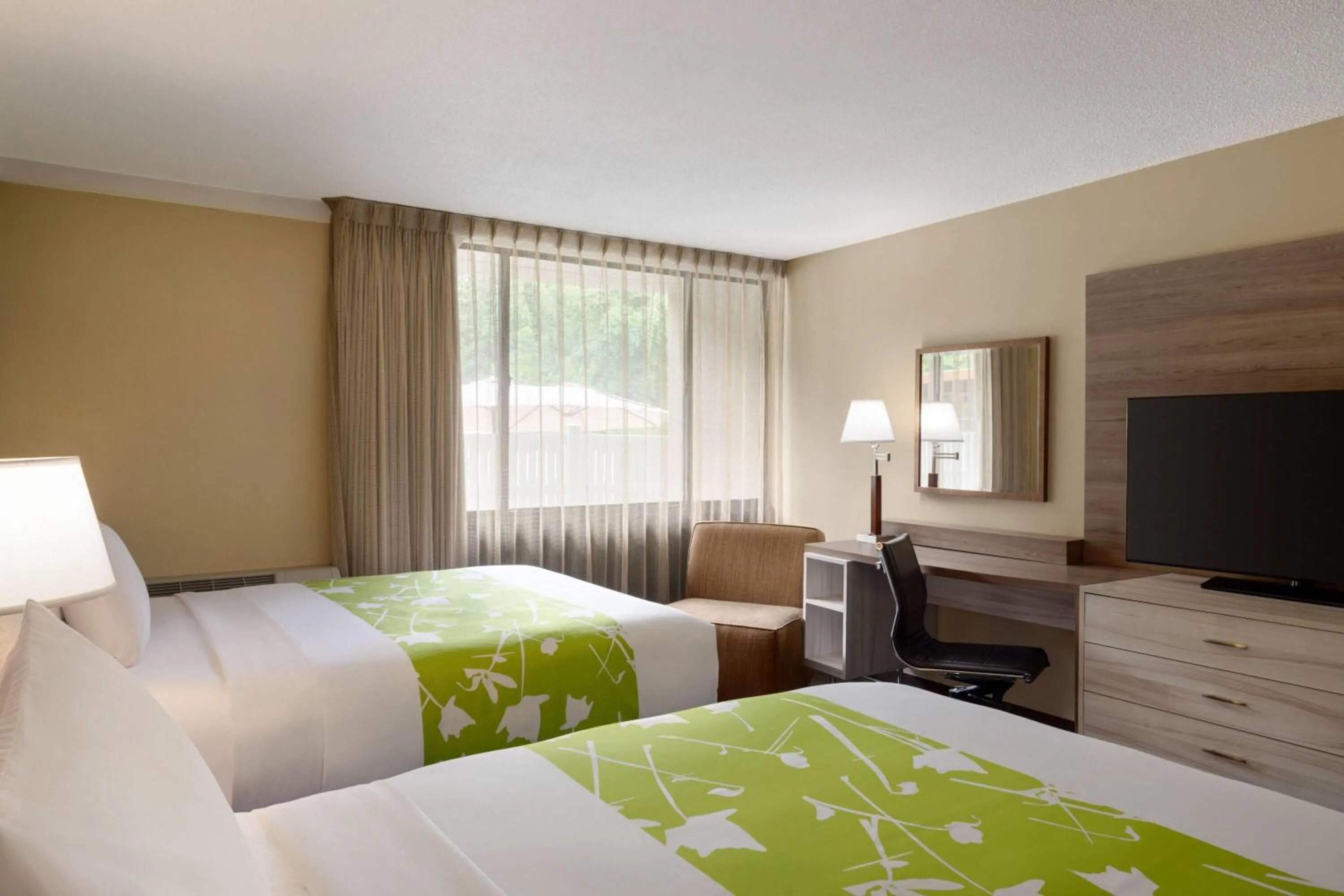 Photo of the whole room, Bed in Wyndham Garden Washington DC North