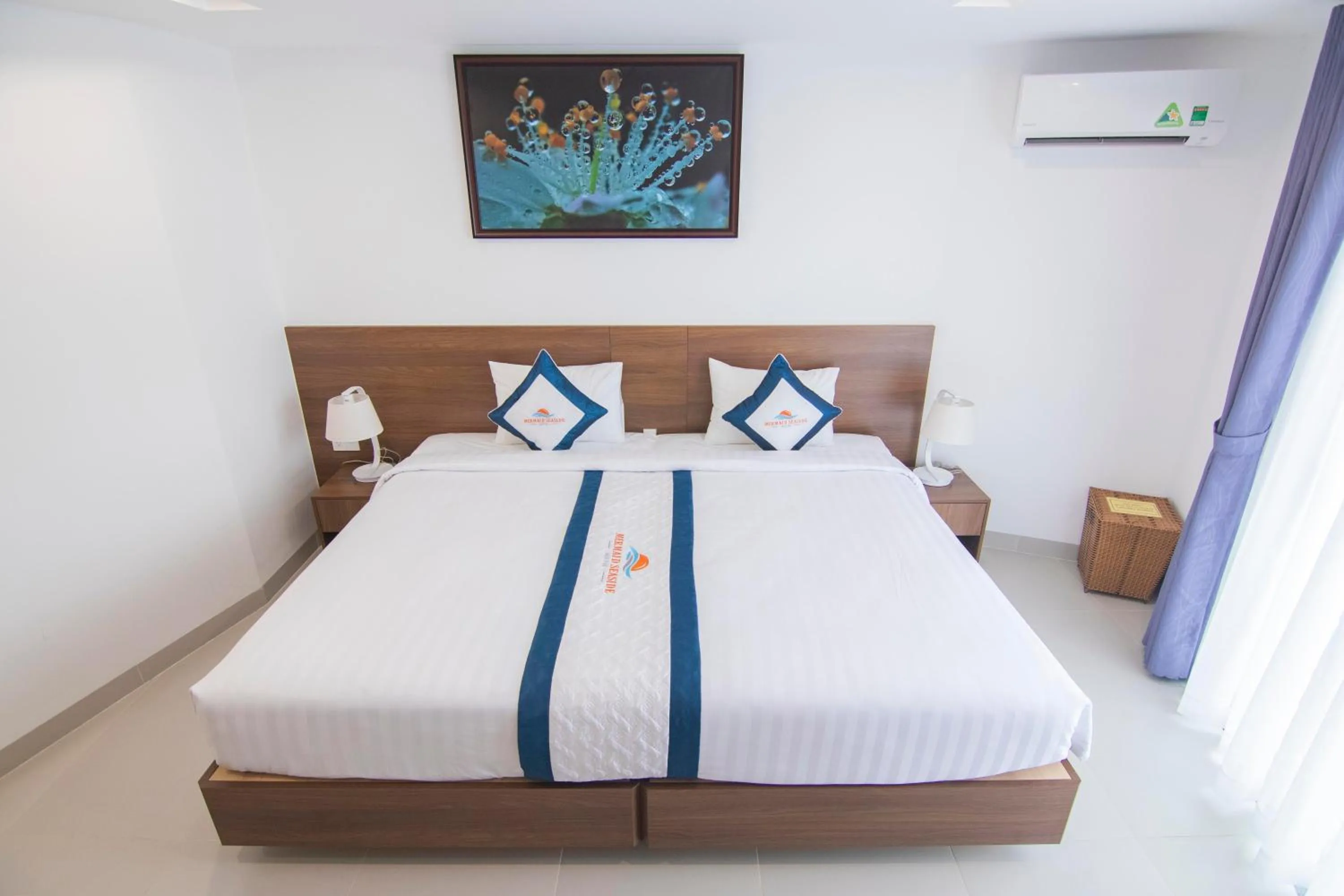 Bed in Mermaid Seaside Hotel