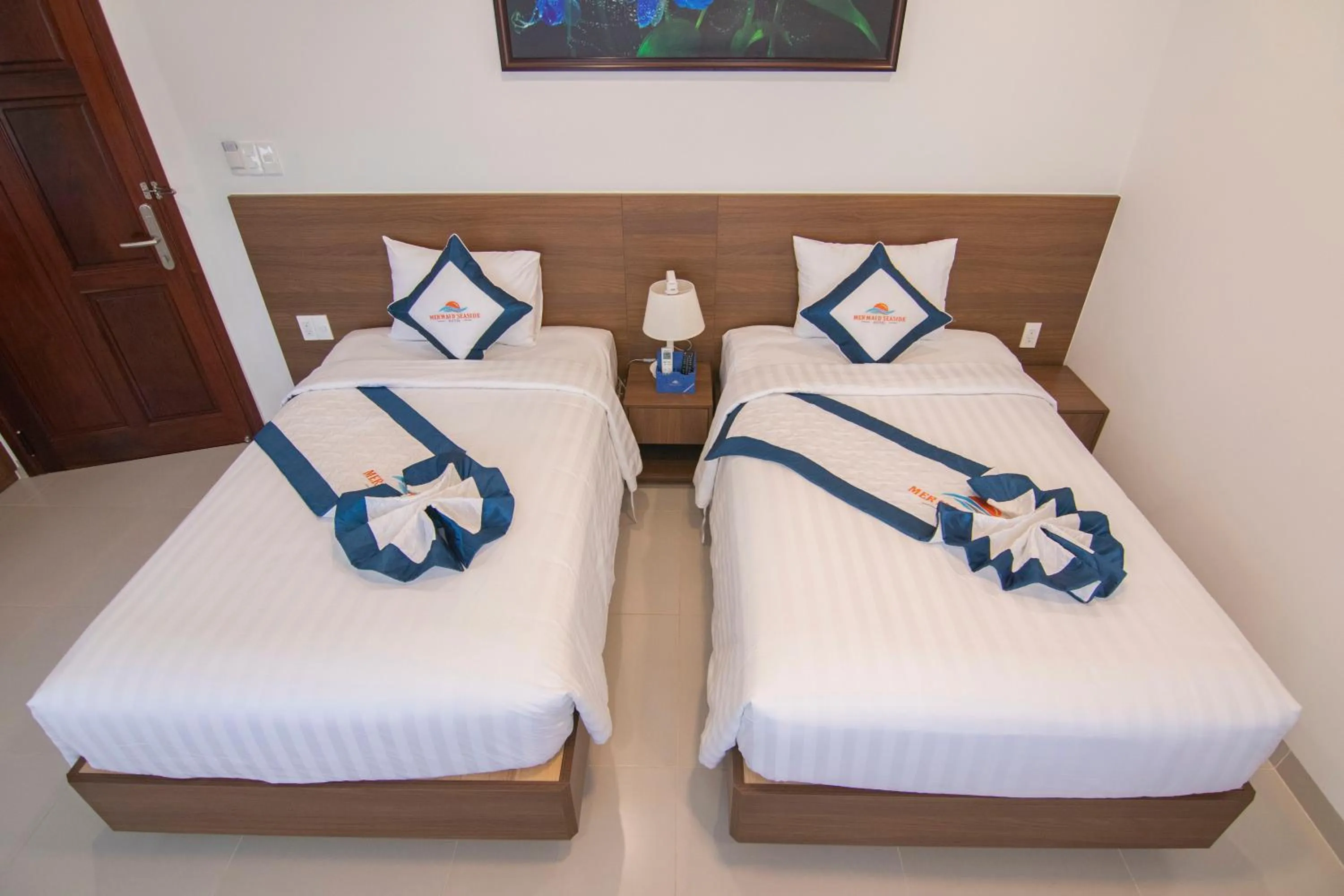 Bed in Mermaid Seaside Hotel