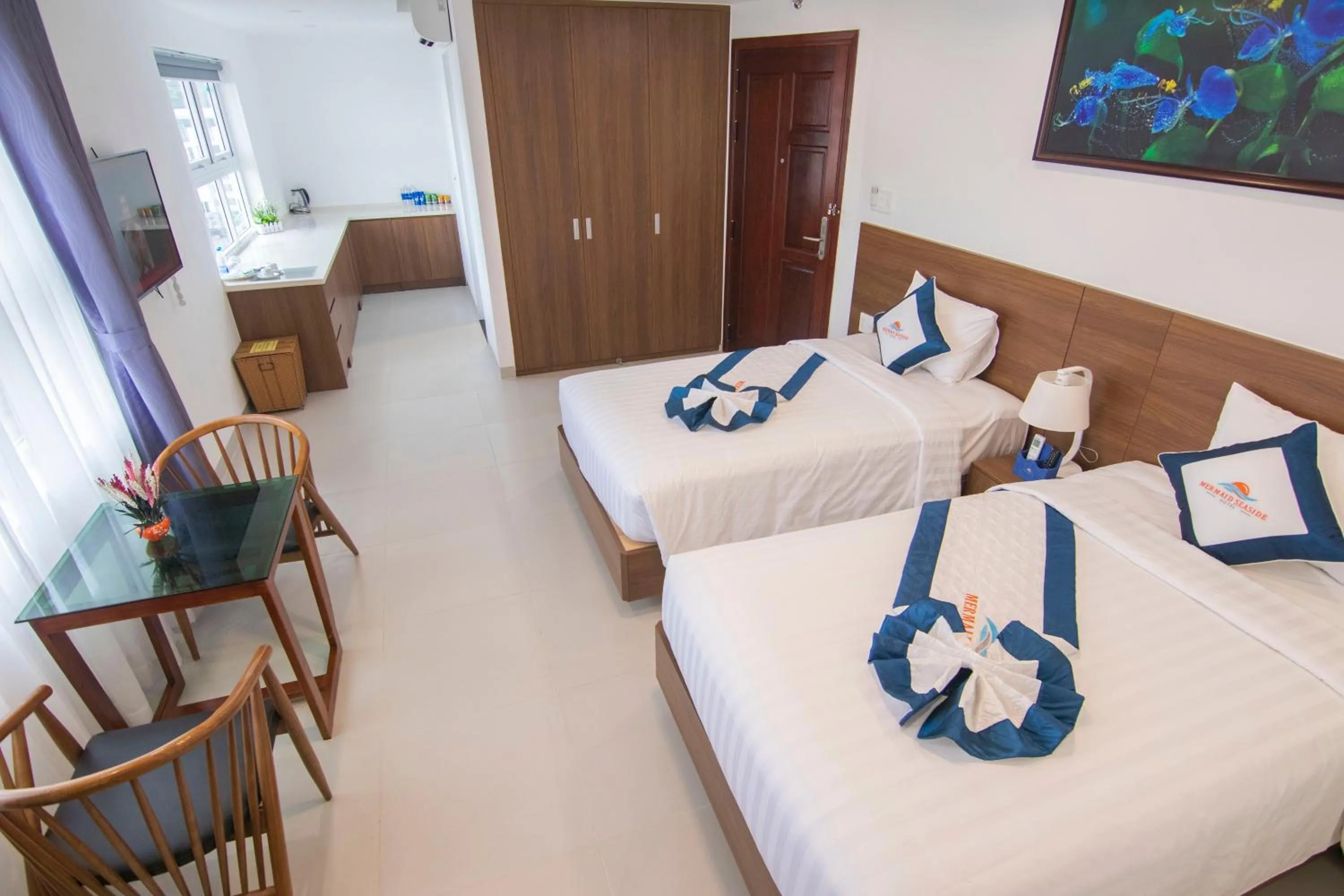 Bed in Mermaid Seaside Hotel