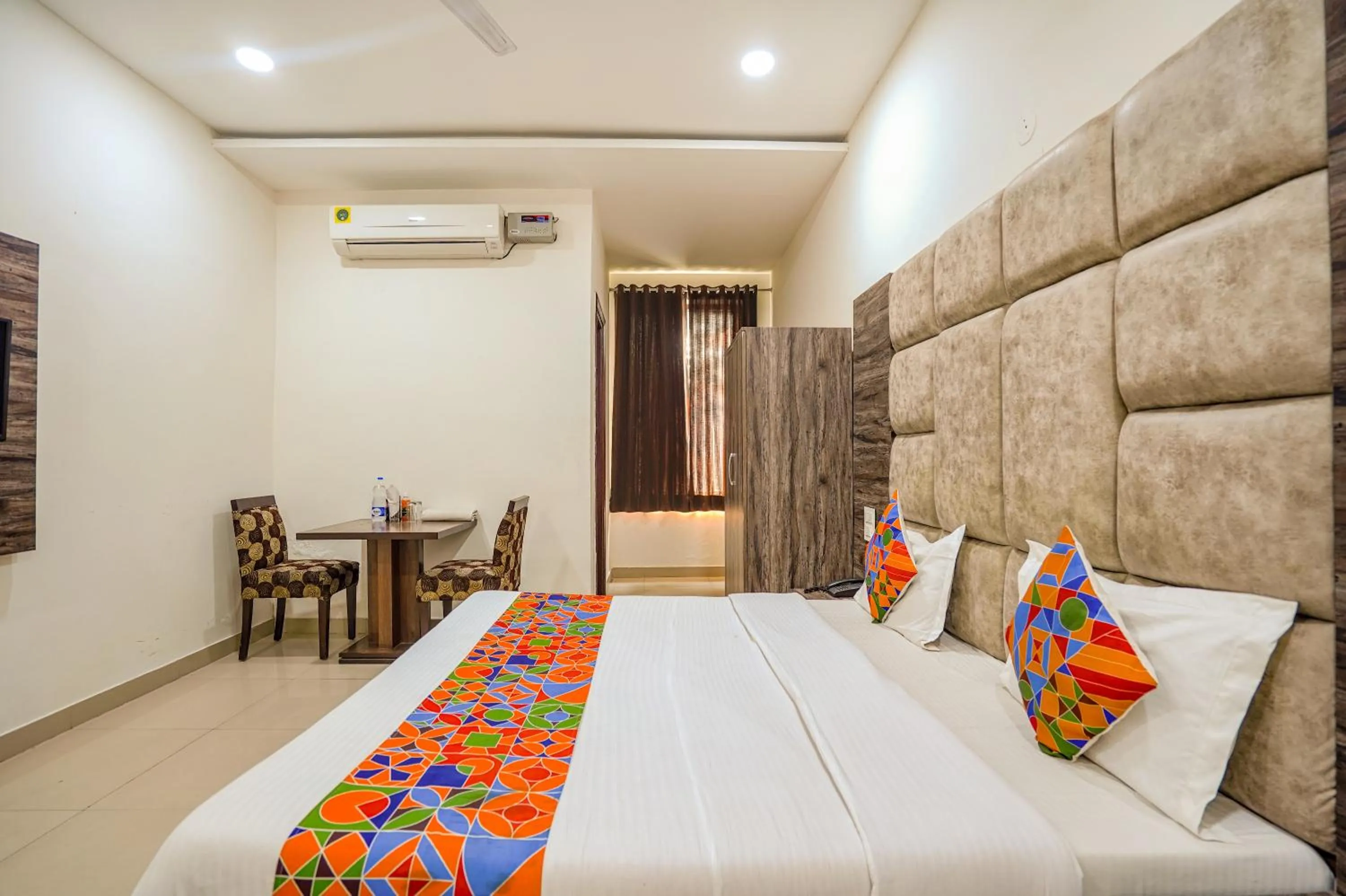 Bed in FabHotel Grand Inn