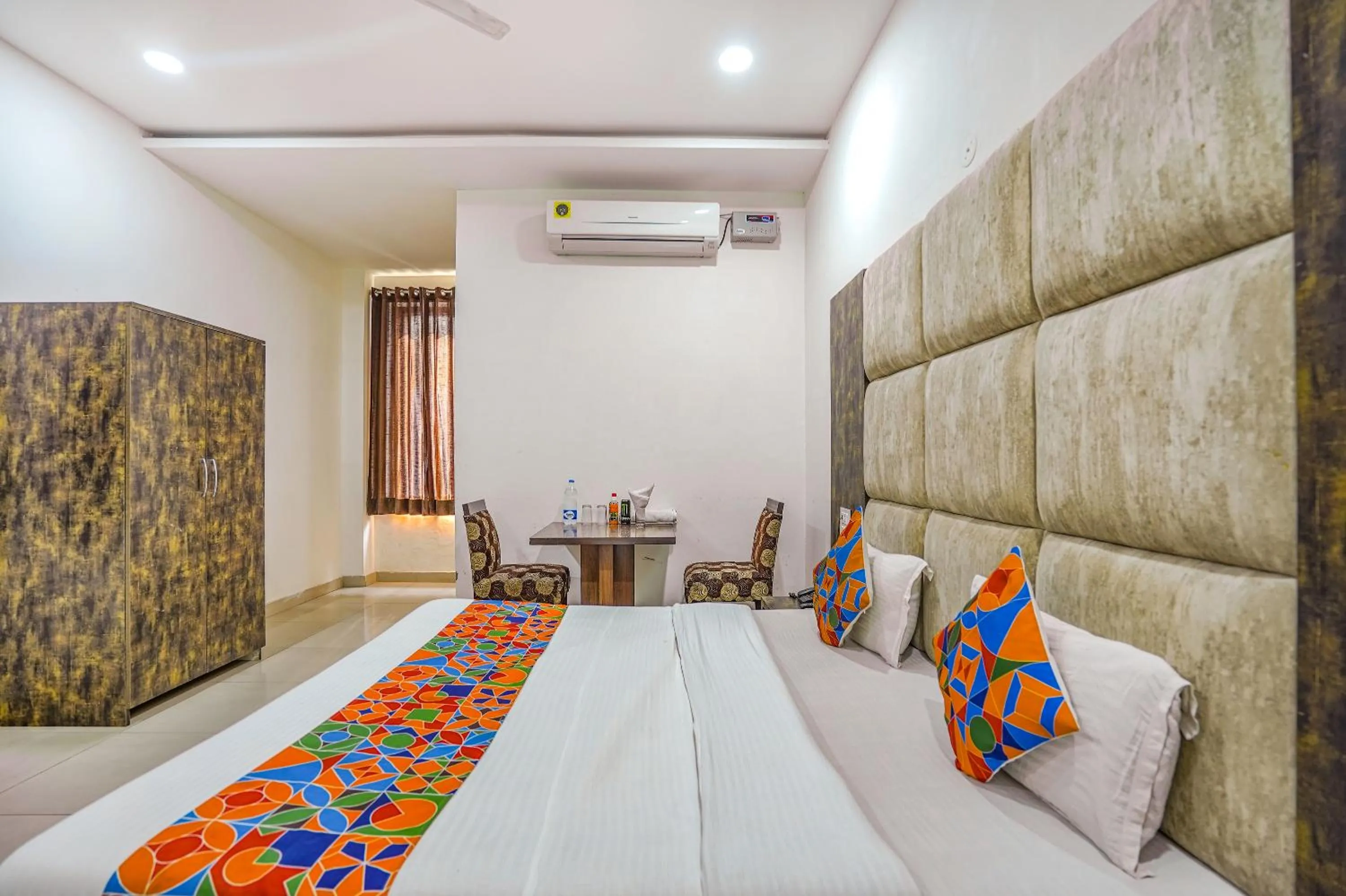 Bed in FabHotel Grand Inn