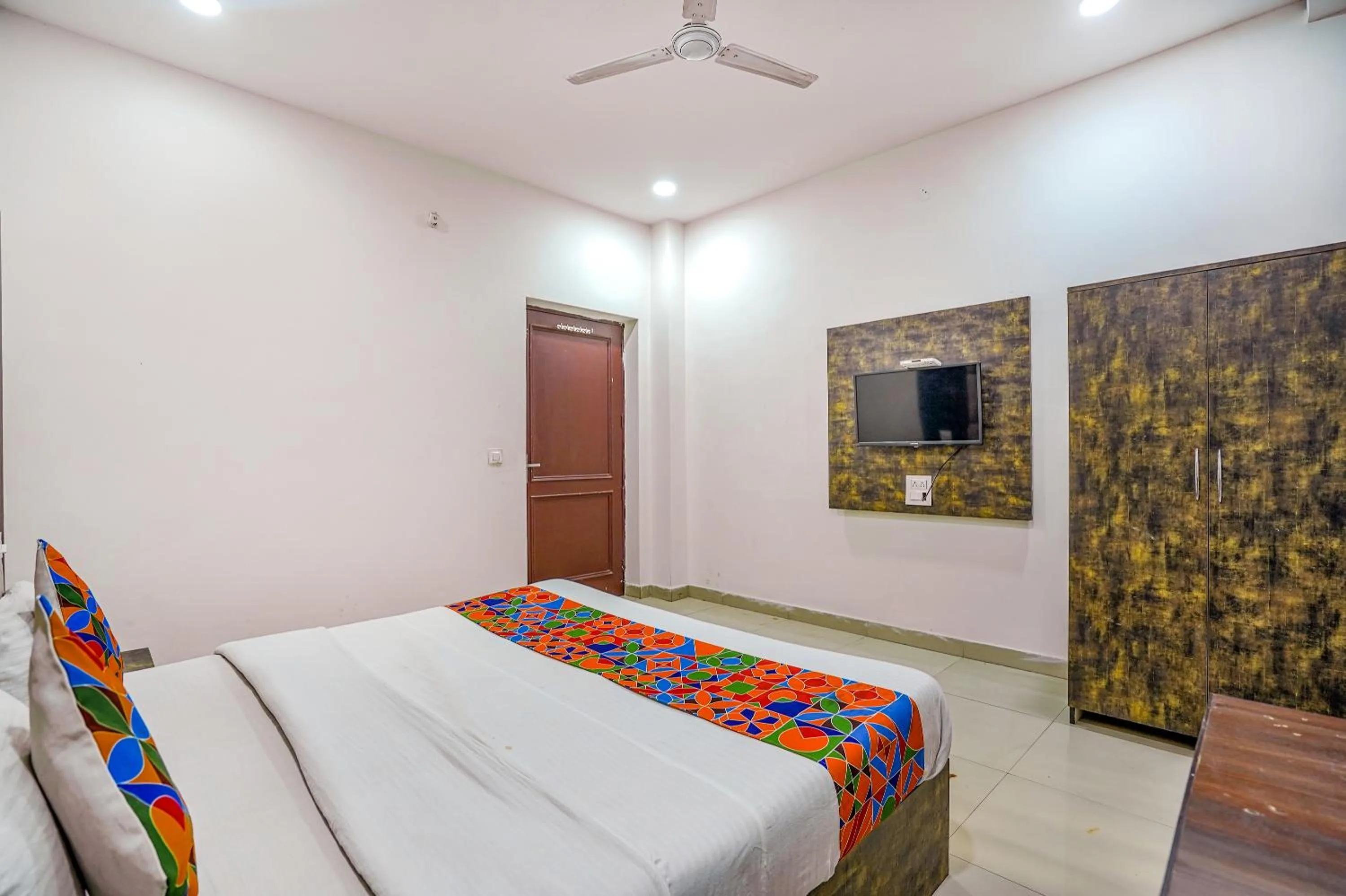 Bed in FabHotel Grand Inn