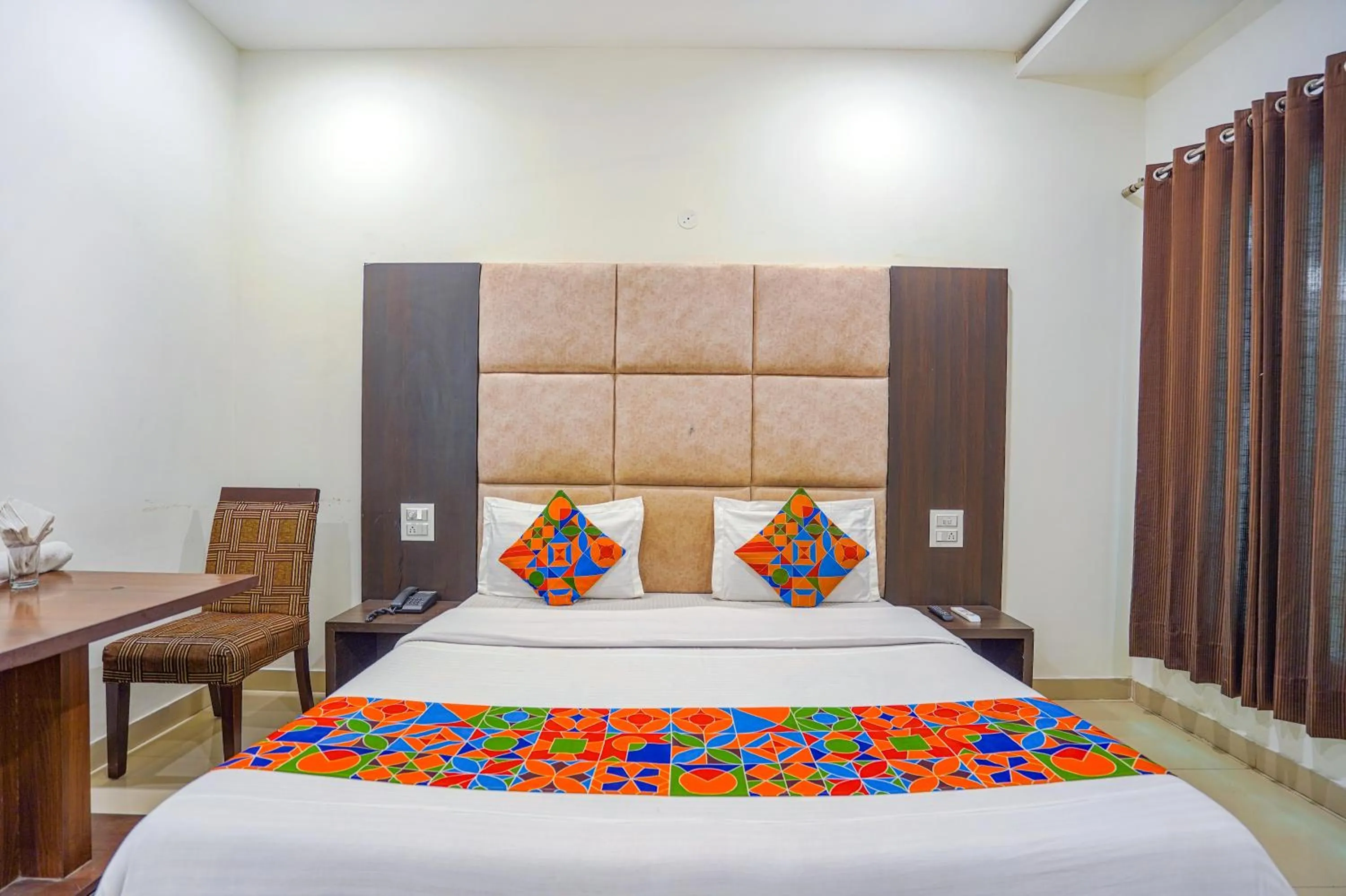 Bed in FabHotel Grand Inn