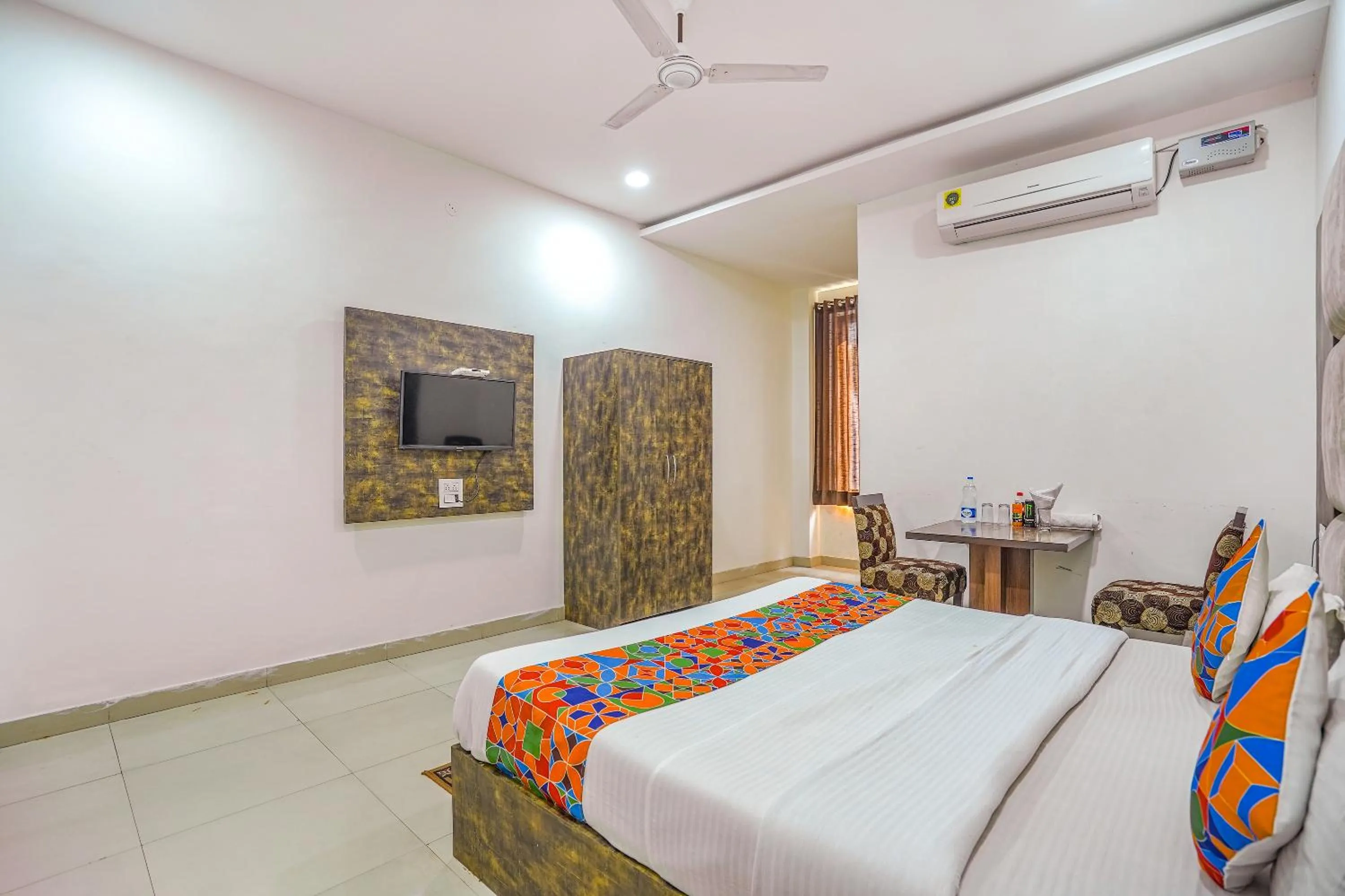 Bed in FabHotel Grand Inn