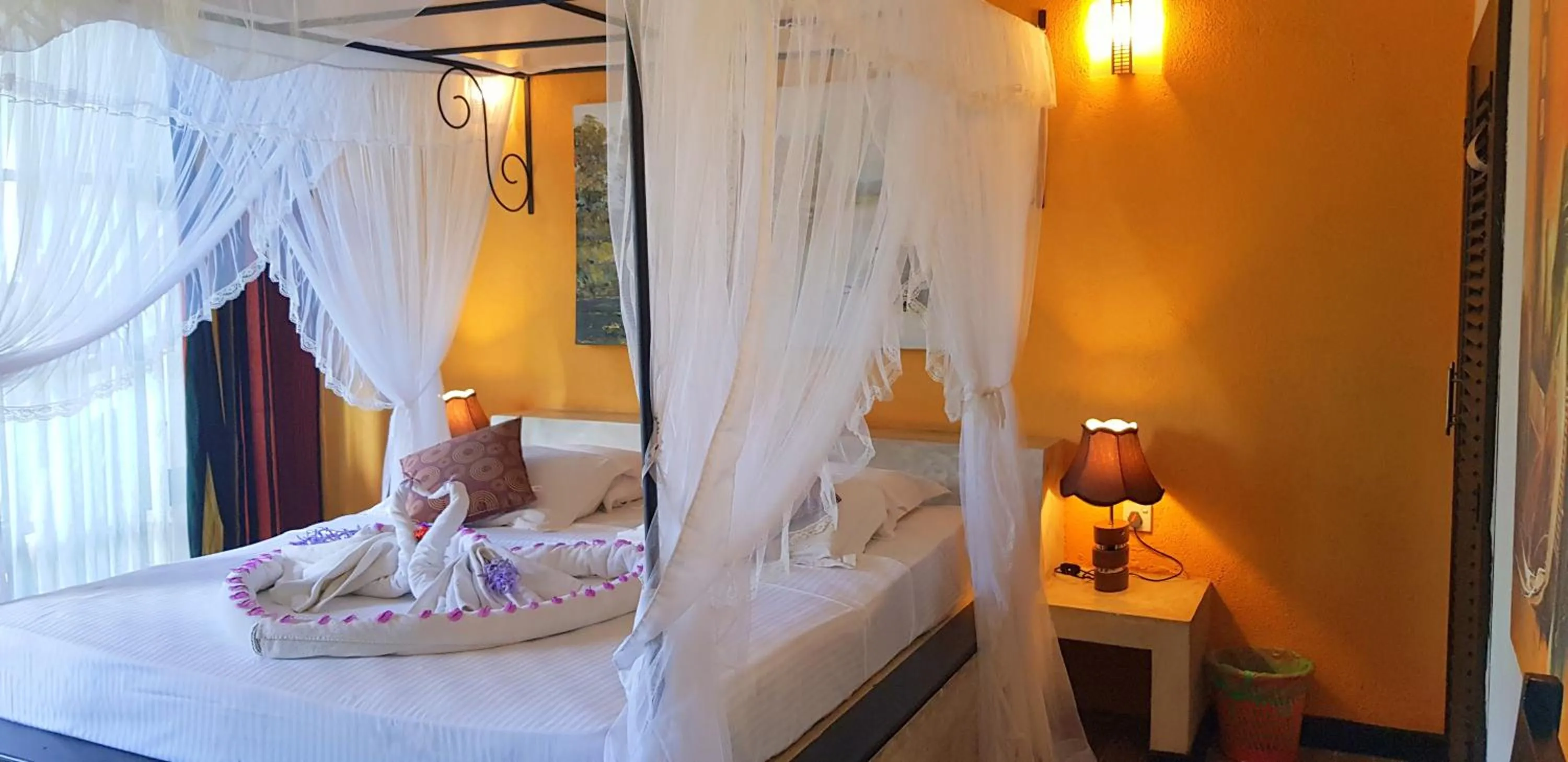 Bed in Flower Garden Lake Resort